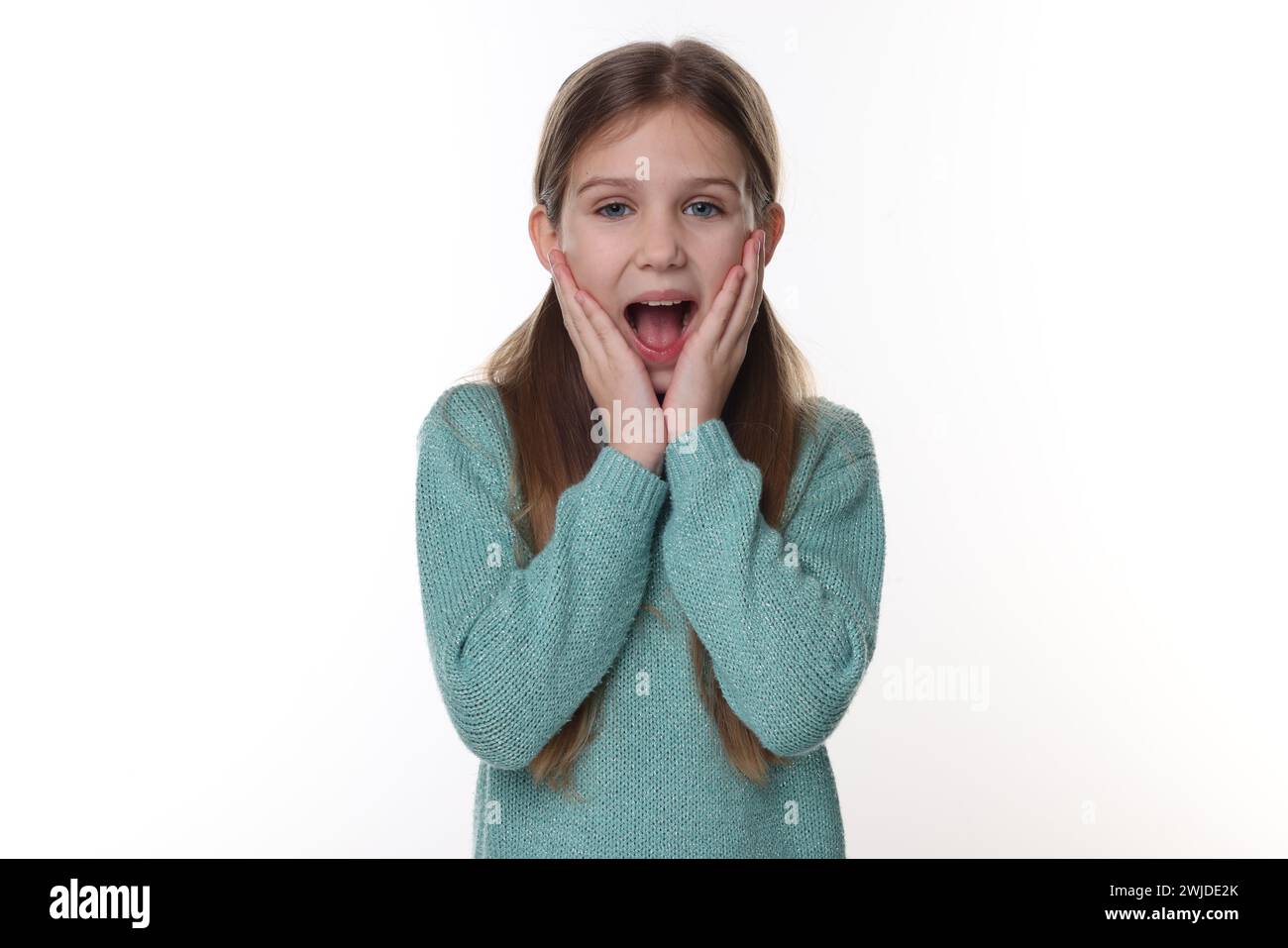 Portrait of surprised girl on white background Stock Photo - Alamy