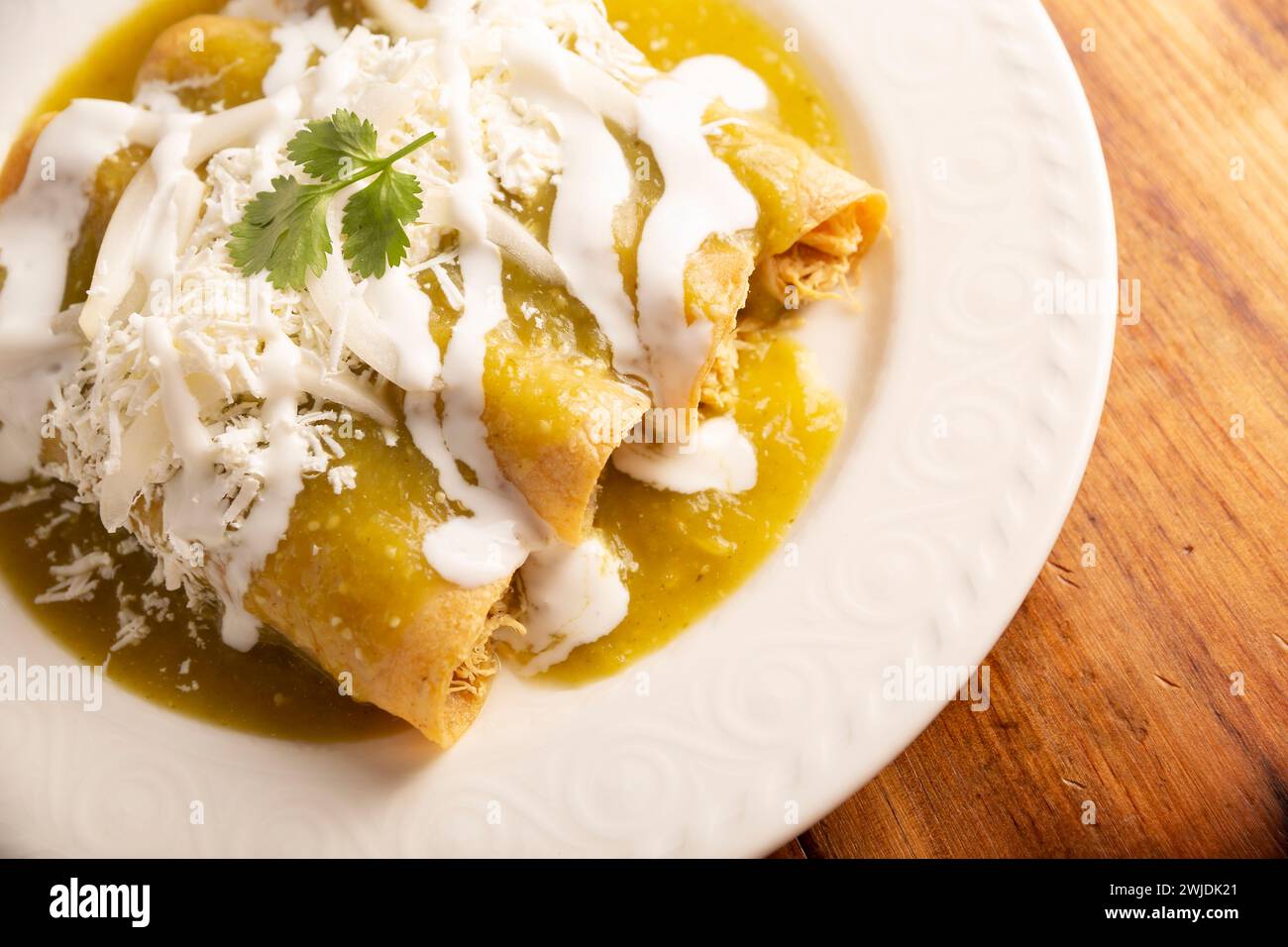 Green enchiladas. Typical Mexican dish made with a folded or rolled