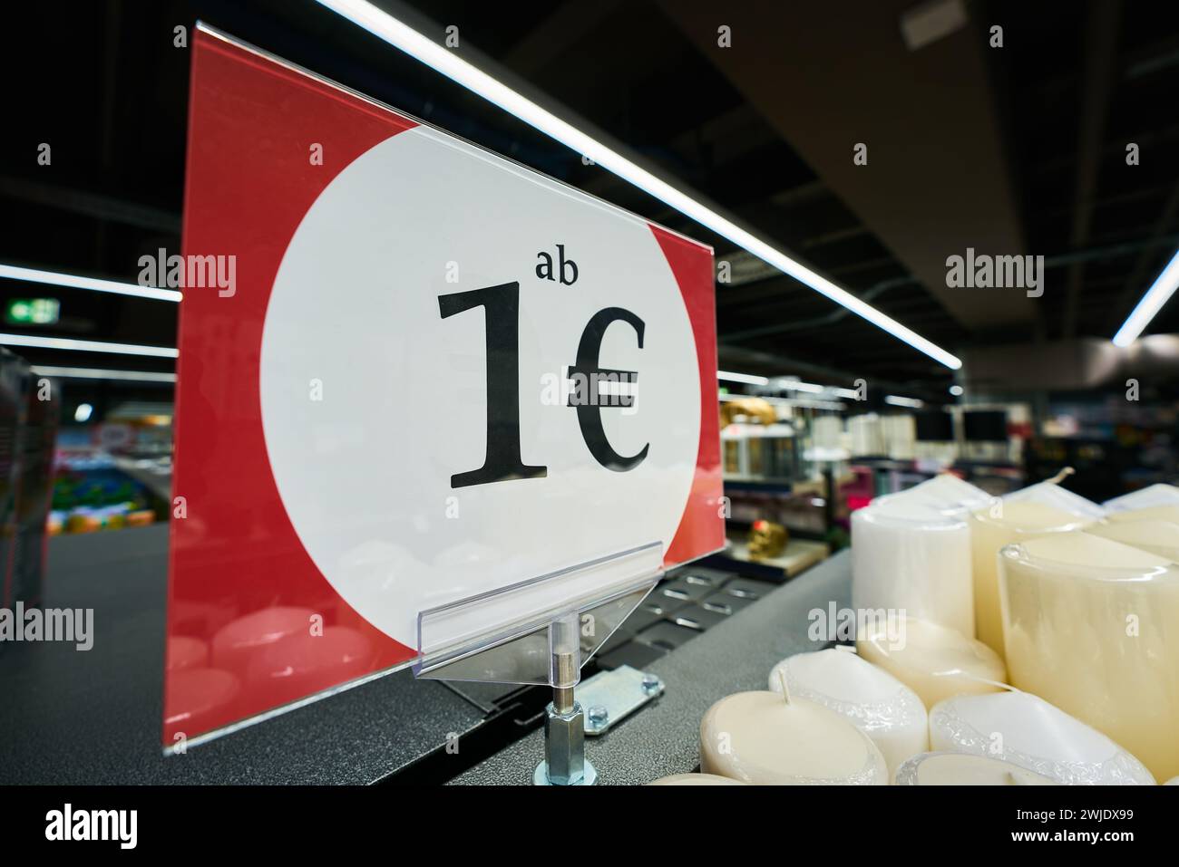 Reference to a special offer with a sign in a store with the German inscription ab 1€. Translation: Price from 1 Euro Stock Photo