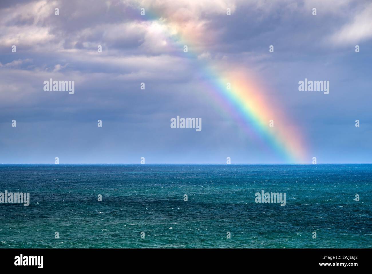 Rainbow on the sea, Asturias, Spain Stock Photo