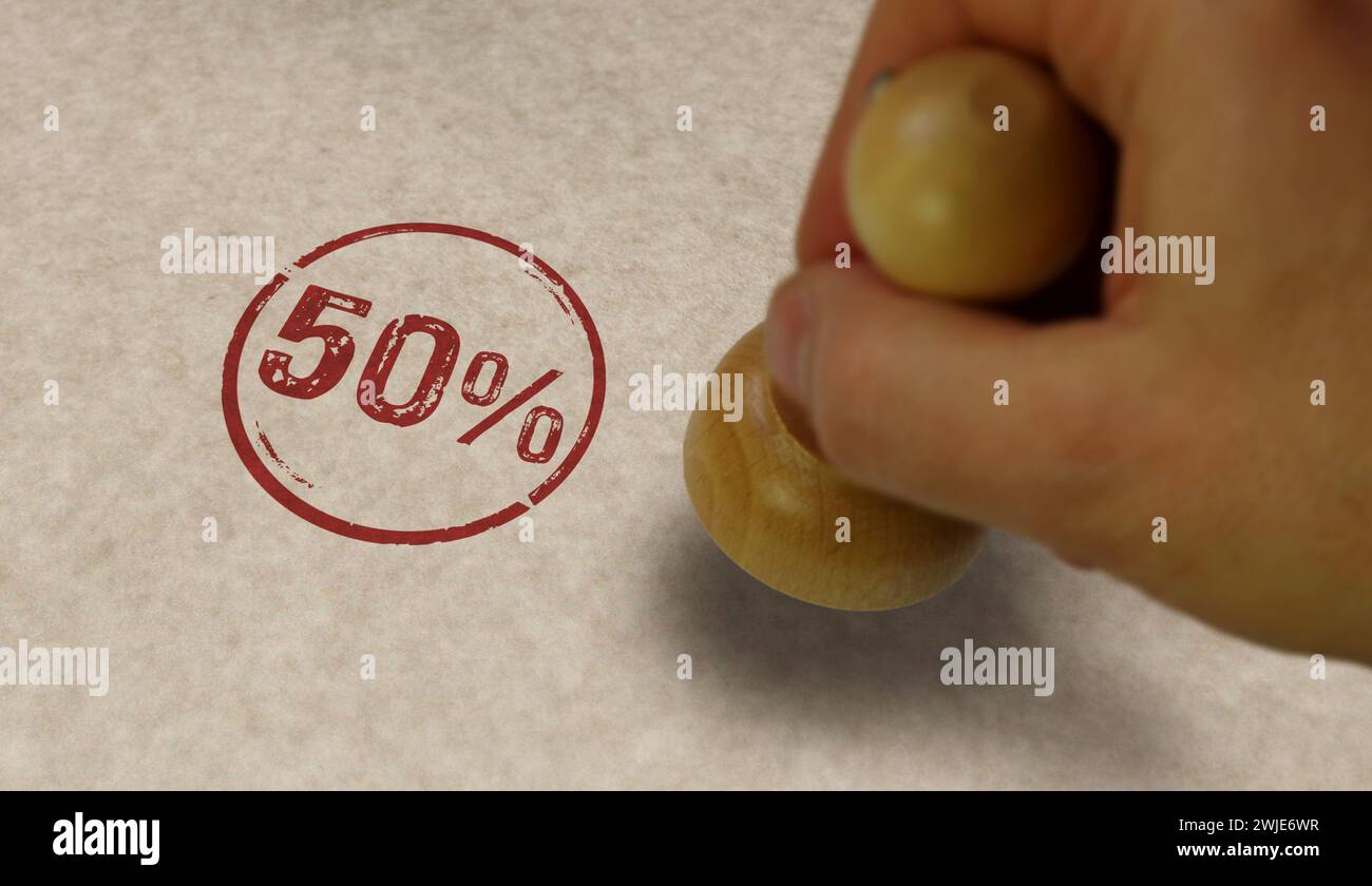 50% 50 percent stamp and stamping hand. Fifty percentage promotion concept. Stock Photo