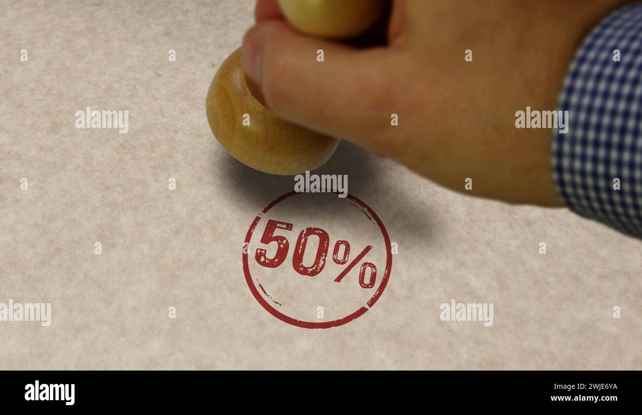 50% 50 percent stamp and stamping hand. Fifty percentage promotion concept. Stock Photo