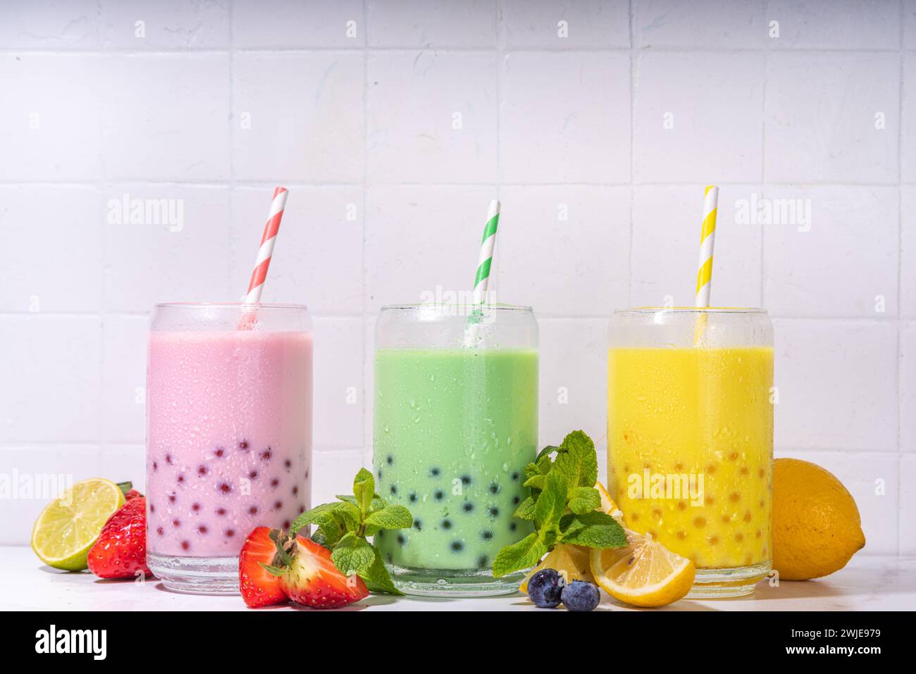 Set of three colorful summer bubble tea, bright creamy pearl tea or ...