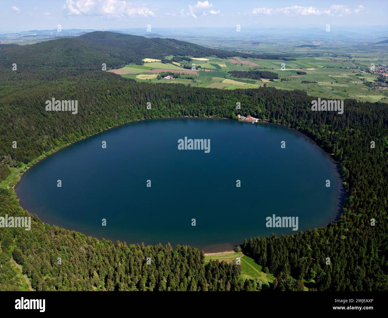Haute-Loire department (south-central France): aerial view of the Bouchet Lake, a crater lake formed from an old volcano, and thus roughly circular, l Stock Photo