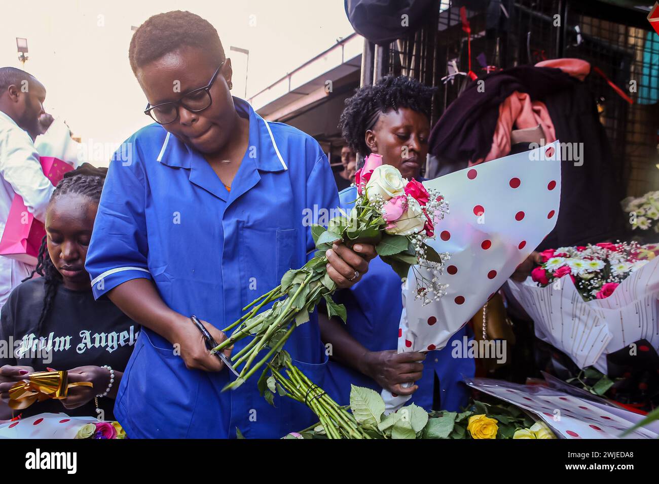 Kenyan women prepare bouquets of flowers at the Nairobi City market