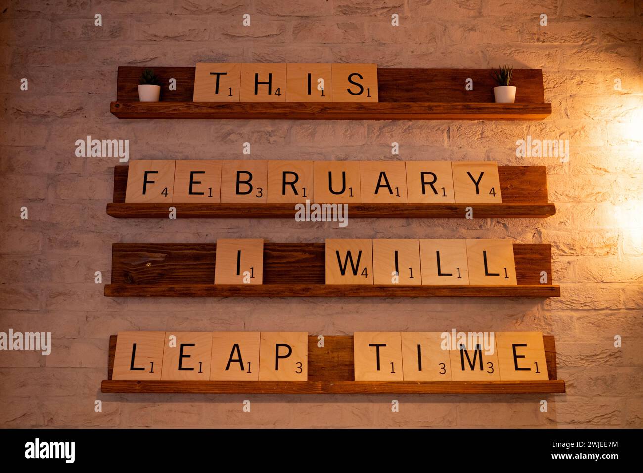 Scotland: 29th Feb 2024: February 2024 Leap Year slogan on giant wooden letters, scrabble style letter pieces Stock Photo