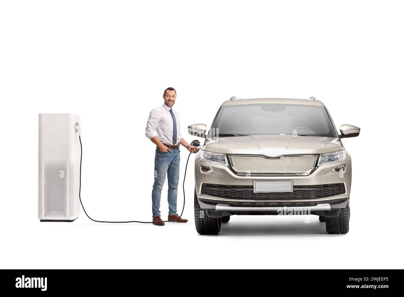 Businessman charging electric vehicle and looking at camera isolated on white background Stock Photo