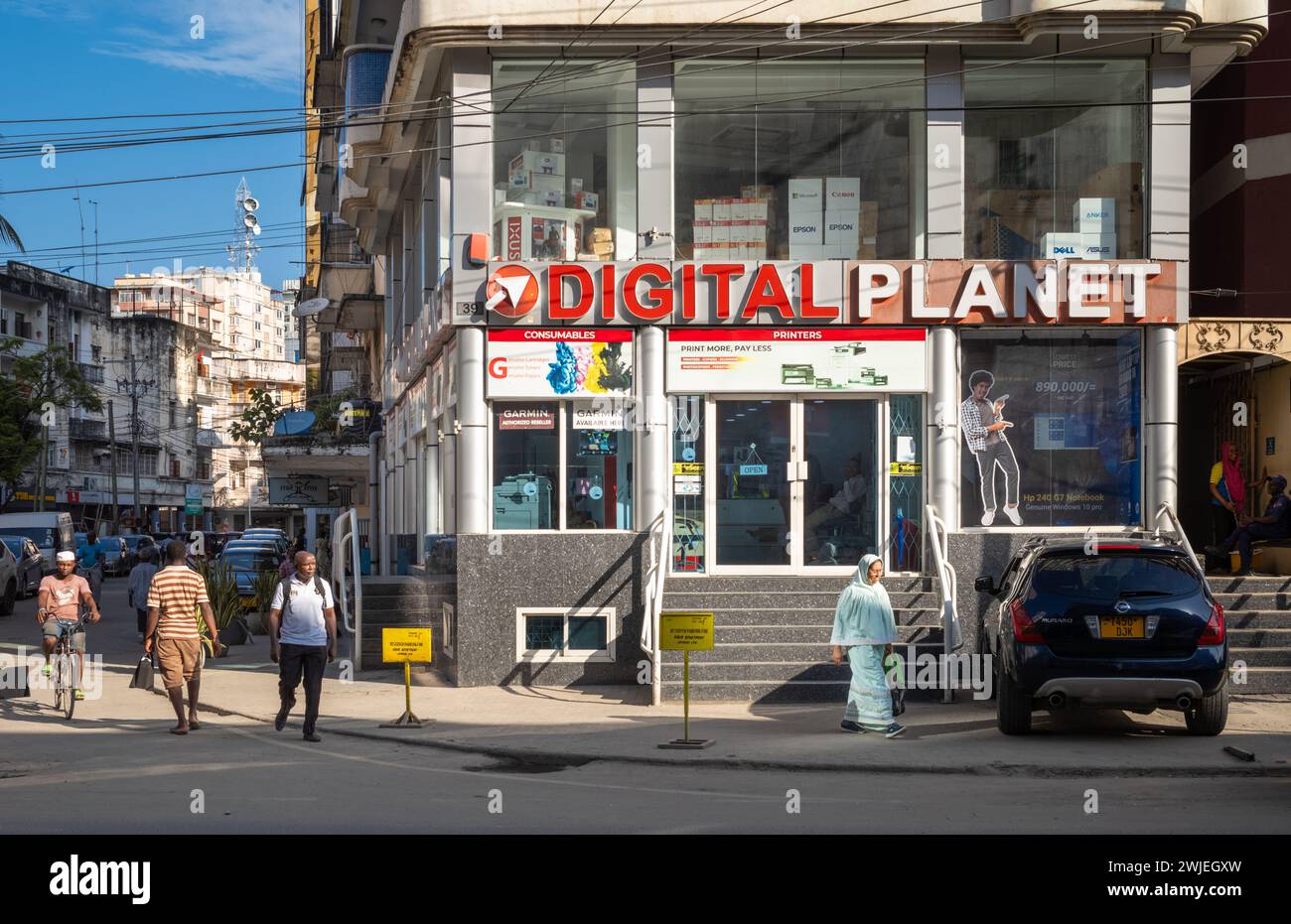 People walk past a modern electronics shop called Digital Planet in ...