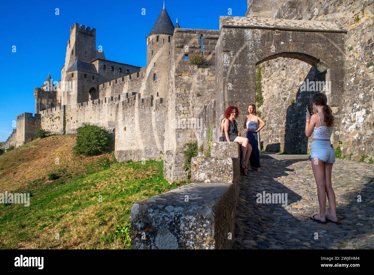 Tourists on ramparts at Carcassonne walls medieval castle fortress in ...