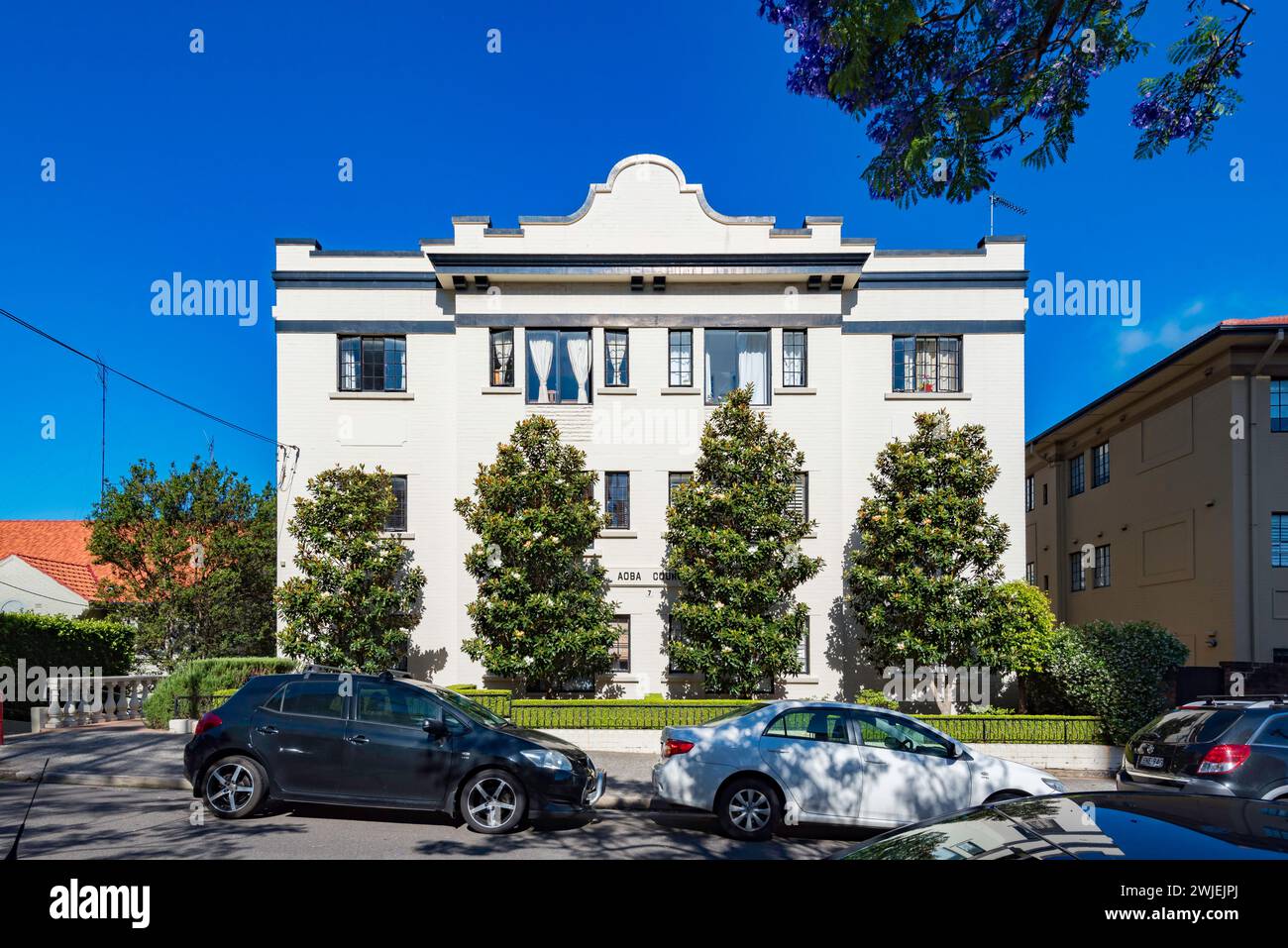 A Three/Five storey interwar free classical style painted brick apartment building in McMahons Point, Sydney, Australia Stock Photo