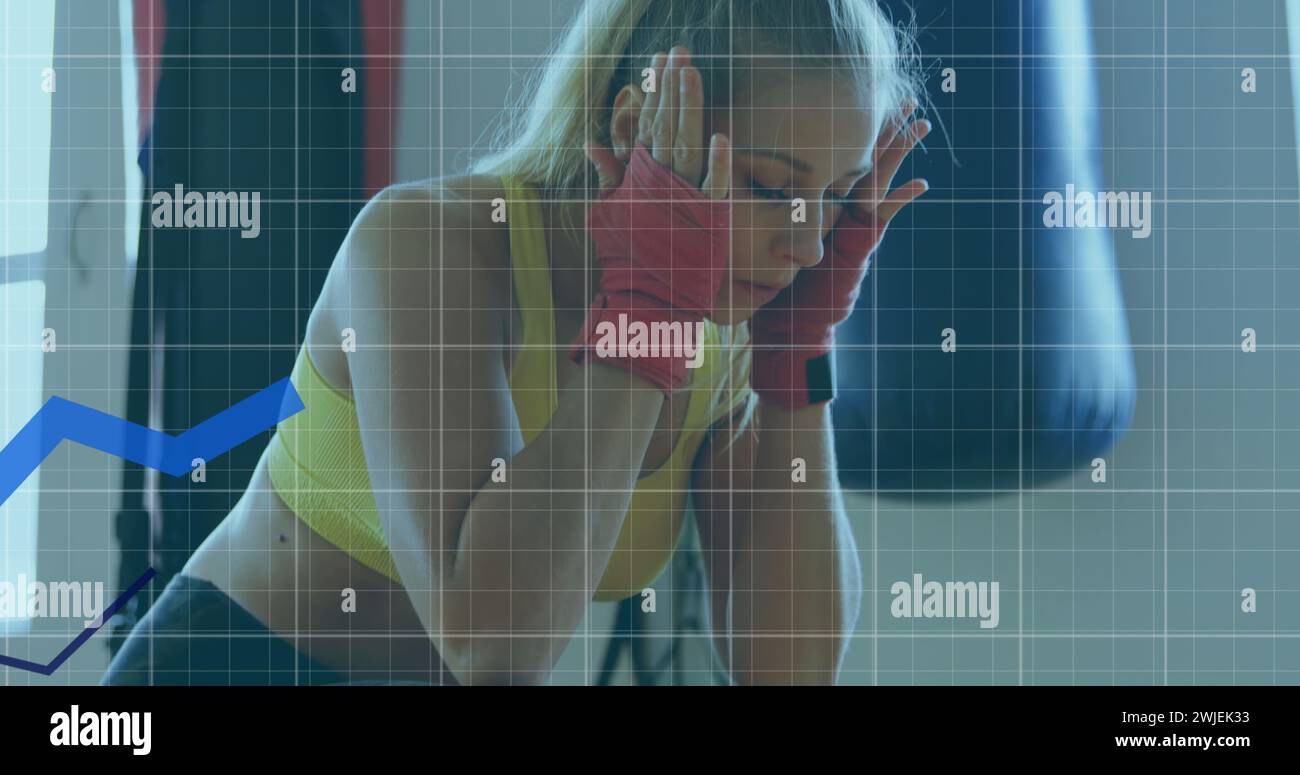 Digital interface tracks woman's exercise in a global tech concept image. Stock Photo