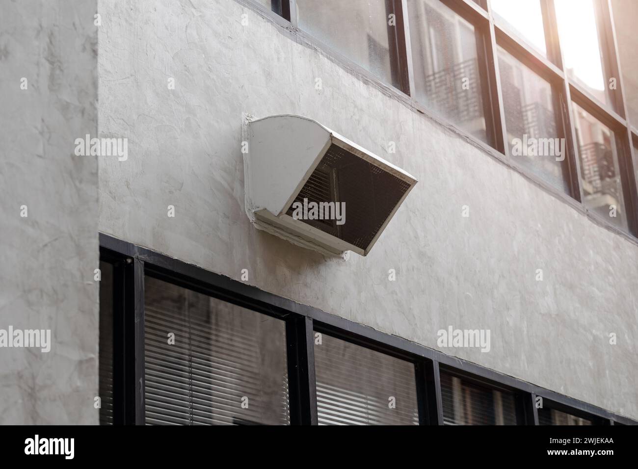 office building air ventilator pipe hole ventilates hot air from inside building to outside. Stock Photo