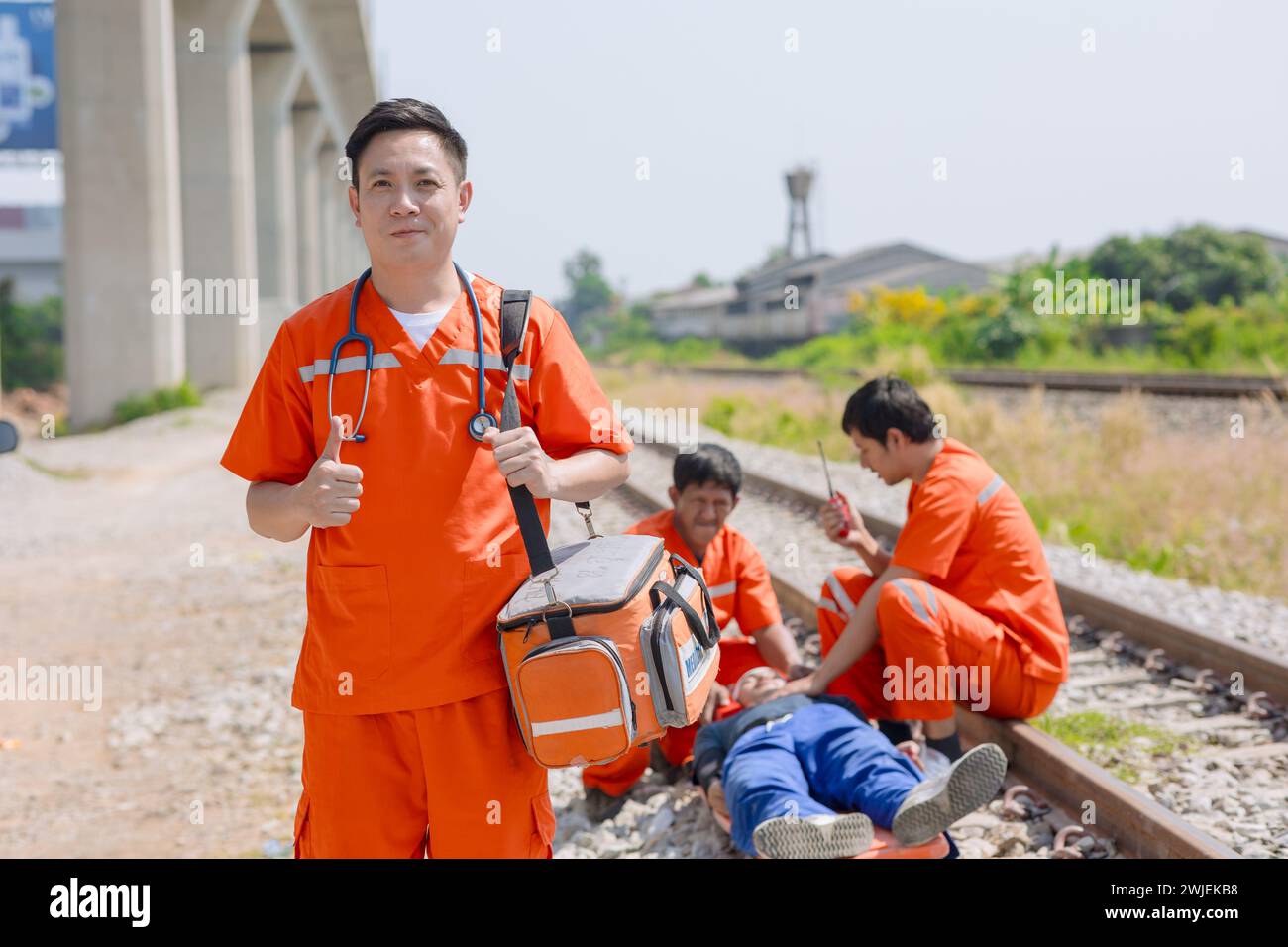 paramedic,medical,emergency,doctor,team,working,in,action,help,first,aid,save,people,life,at,accident,site,outdoors Stock Photo