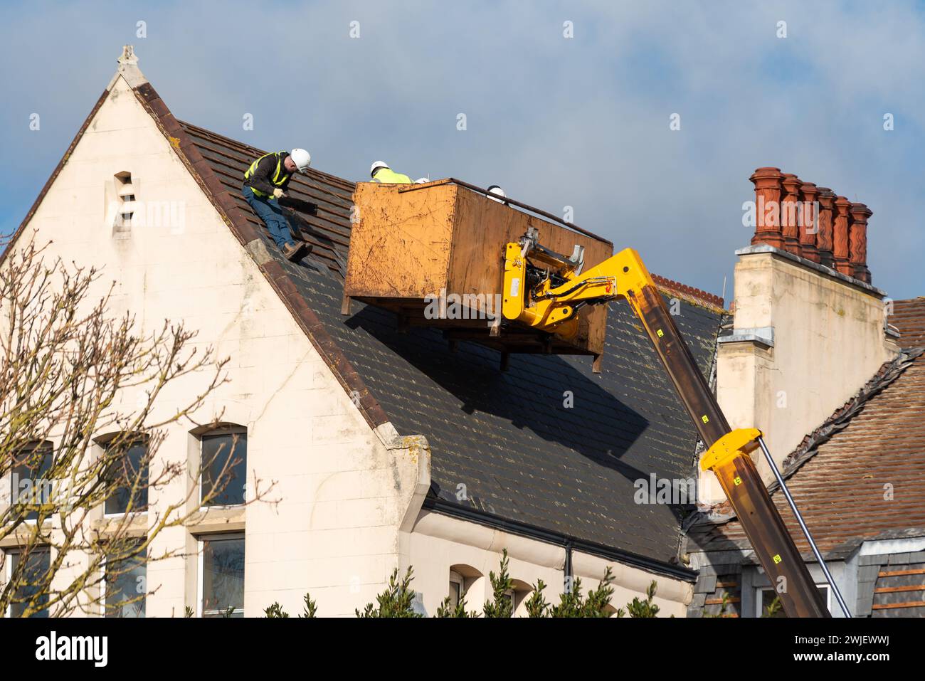 Demolition of Nazareth House in Southend, Essex, former convent nursing & residential home operated by the Sisters of Nazareth. Roof slate removal Stock Photo