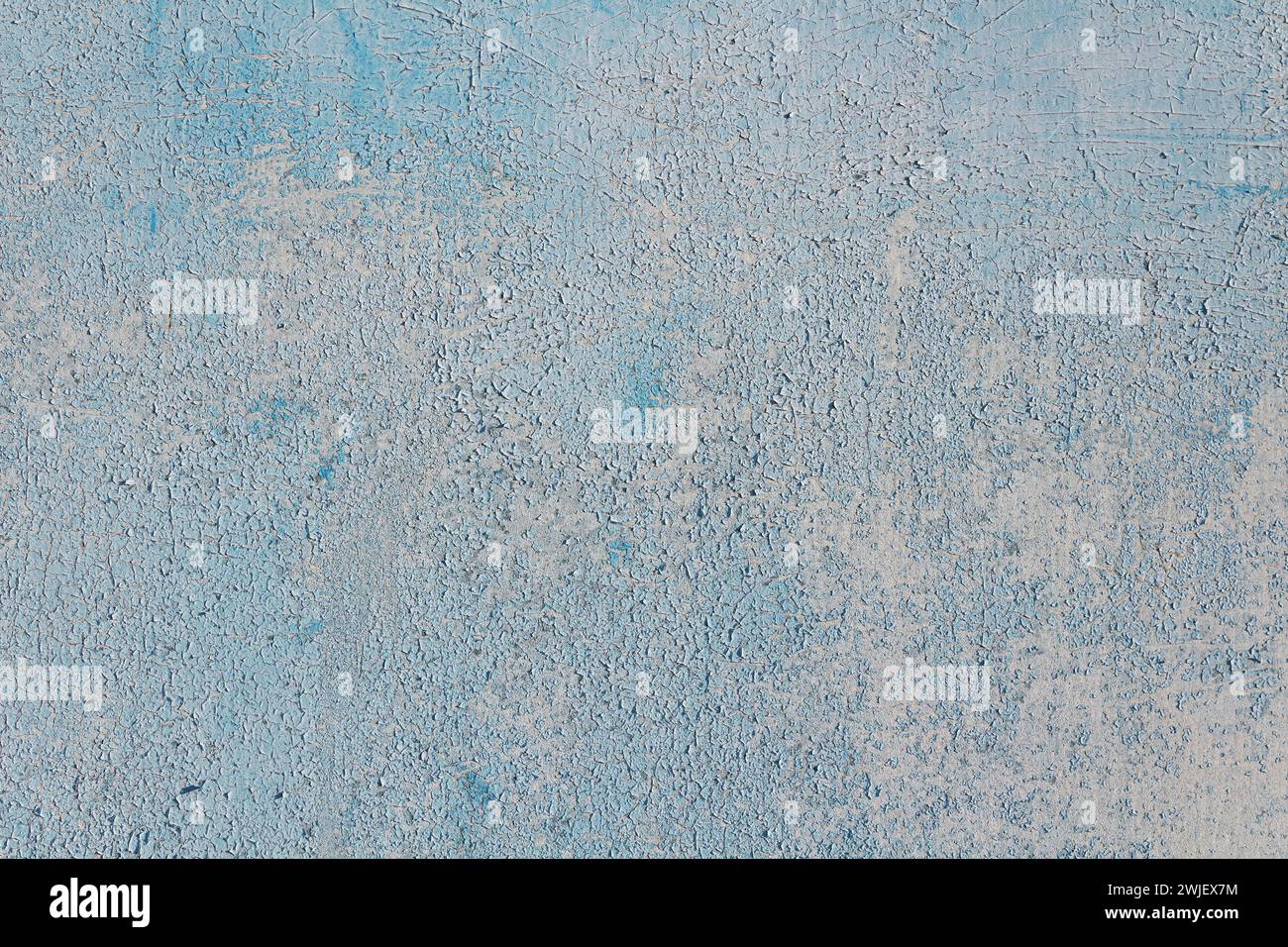 Soft blue abstract background with cracked paint. Stock Photo