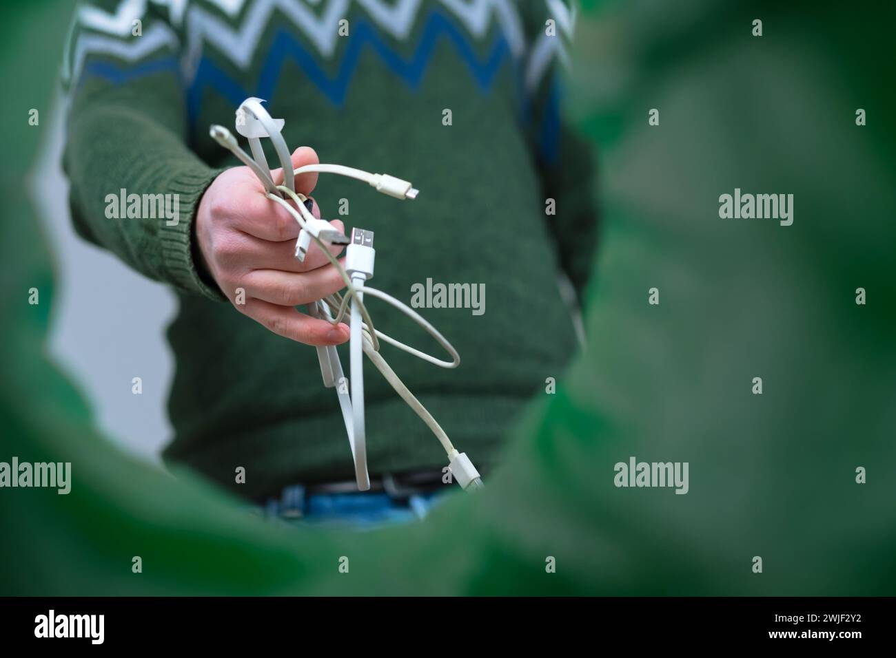 Low angle view hands male sorting nearest ewaste in recycle bin in