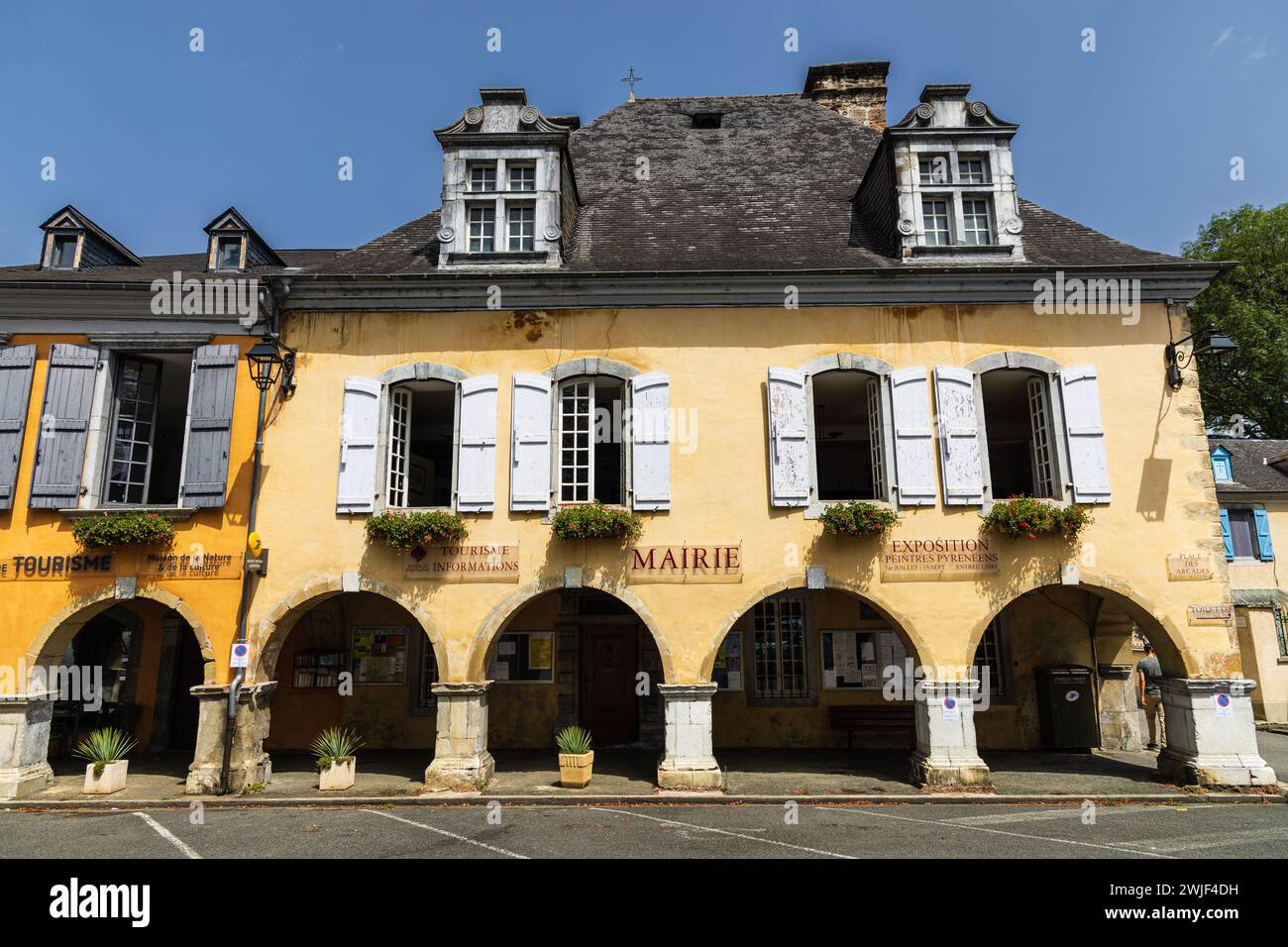 The Town Hall (Mairie), old traditional building with 17th century casement windows in the imposing slate attic. Saint-Pé-de-Bigorre, France. Stock Photo