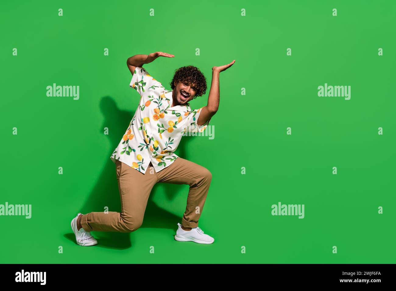Full length photo of handsome young guy push up heavy empty space wear ...