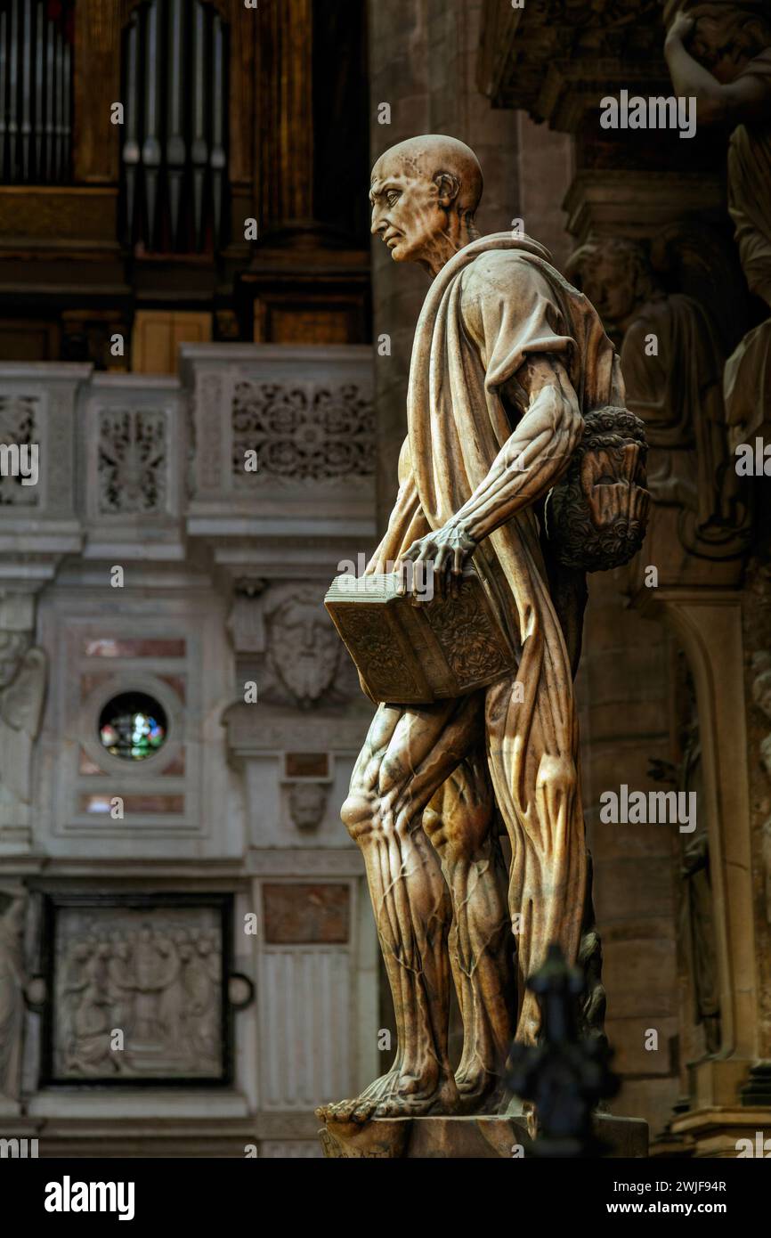 Saint Bartholomew sculpture in the cathedral of Duomo, in Milan, Italy, Europe. He was one of the 12 Apostles and usually is depicted flayed. Stock Photo