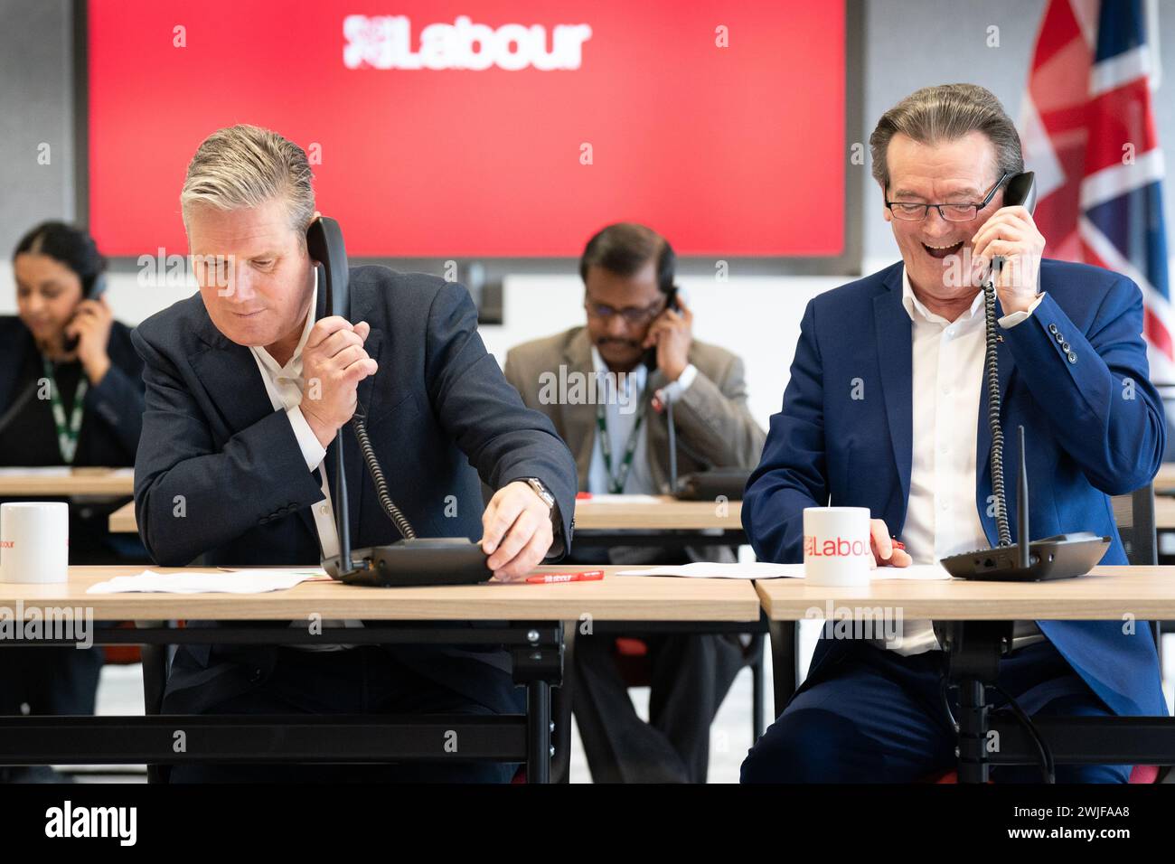 Labour leader Sir Keir Starmer (left) is joined by musician Feargal Sharkey canvassing voters by phone for the Wellingborough and Kingswood by-elections, at Labour HQ in London. Picture date: Thursday February 15, 2024. Stock Photo