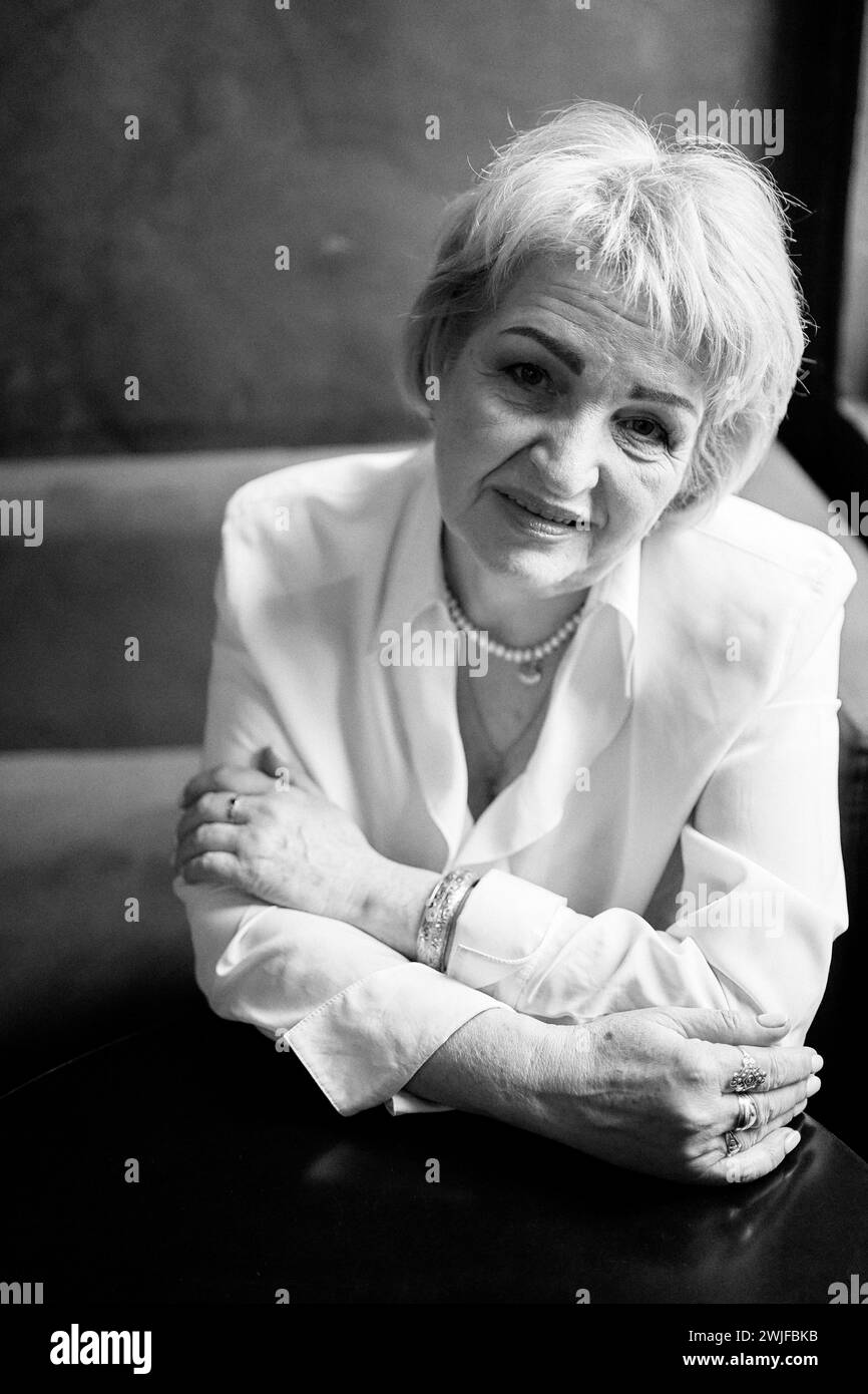 a  portrait of an old woman in a cafe Stock Photo