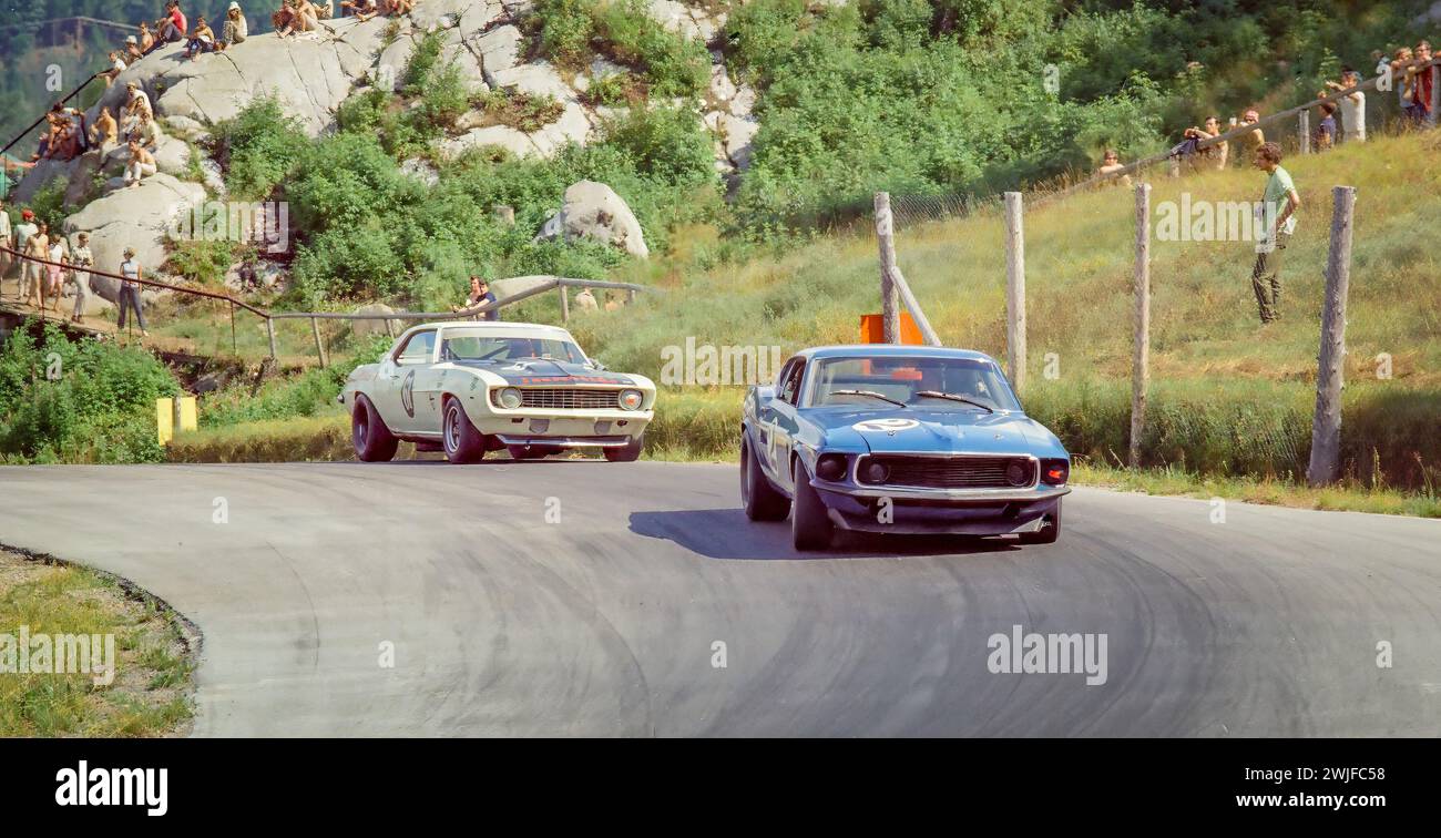 Horst Kwech in a Shelby Racing Ford Mustang Boss 302 ahead of a Chevolet Camaro at the 1969 Trans-Am at  Circuit Mont-Tremblant in St. Jovite, Quebec, DNF Stock Photo