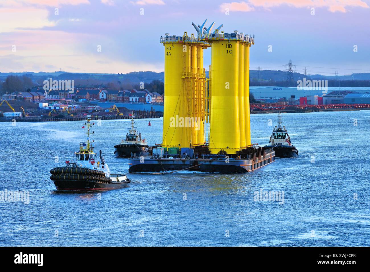 Multratug19 with the DOC CARRIER barge from Smulders  Howdon Tyne Yard taking six wind turbine supports to their   destination in the North Sea as the Stock Photo