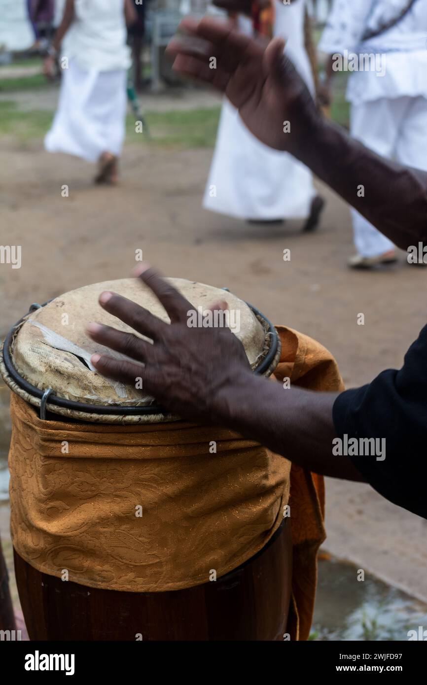 Hands of a percussionist playing atabaque at a religious event. Candomble celebration. Stock Photo