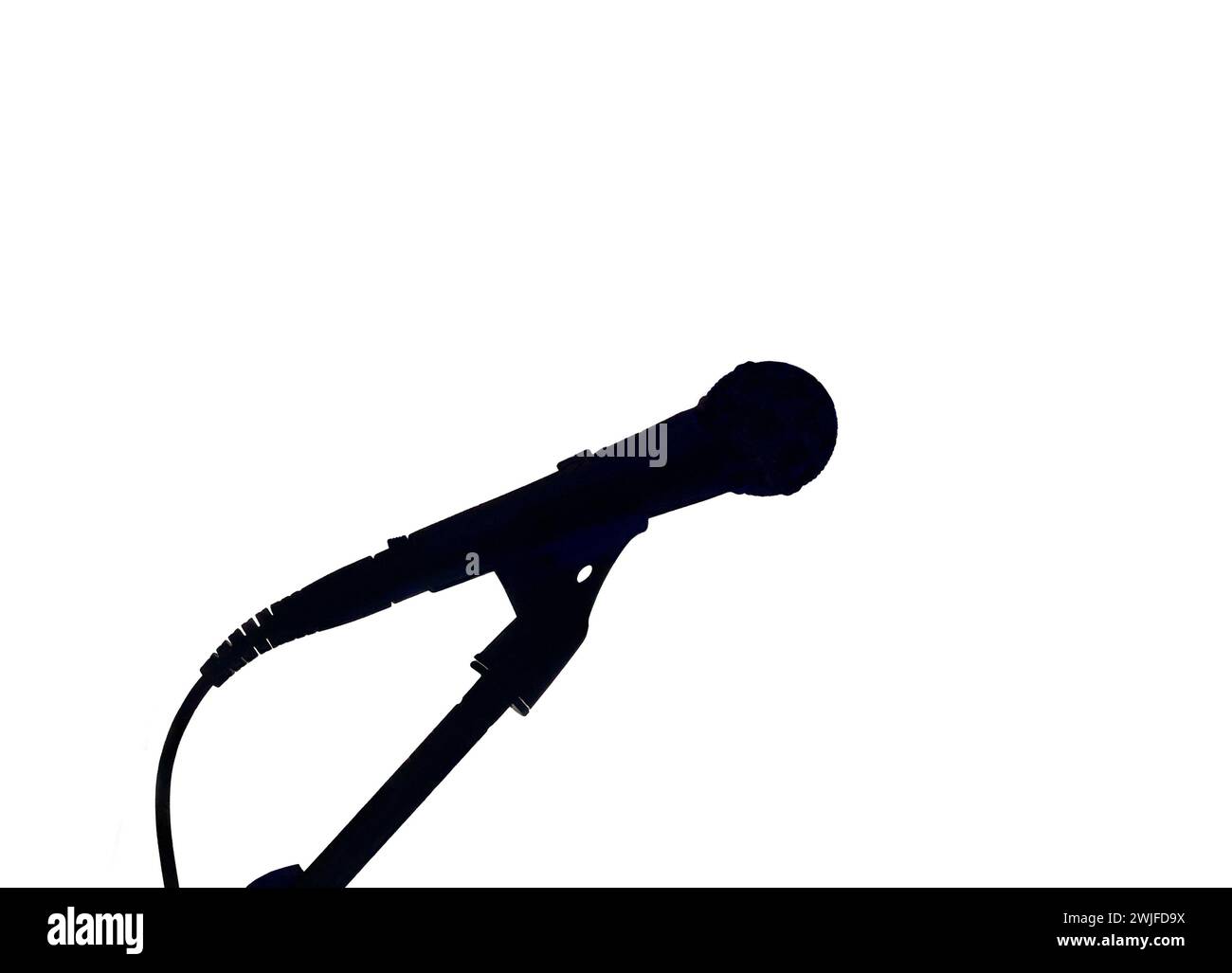 Silhouette of a microphone on a standf isolated on a white background. No people. Music and entertainment concept. Stock Photo