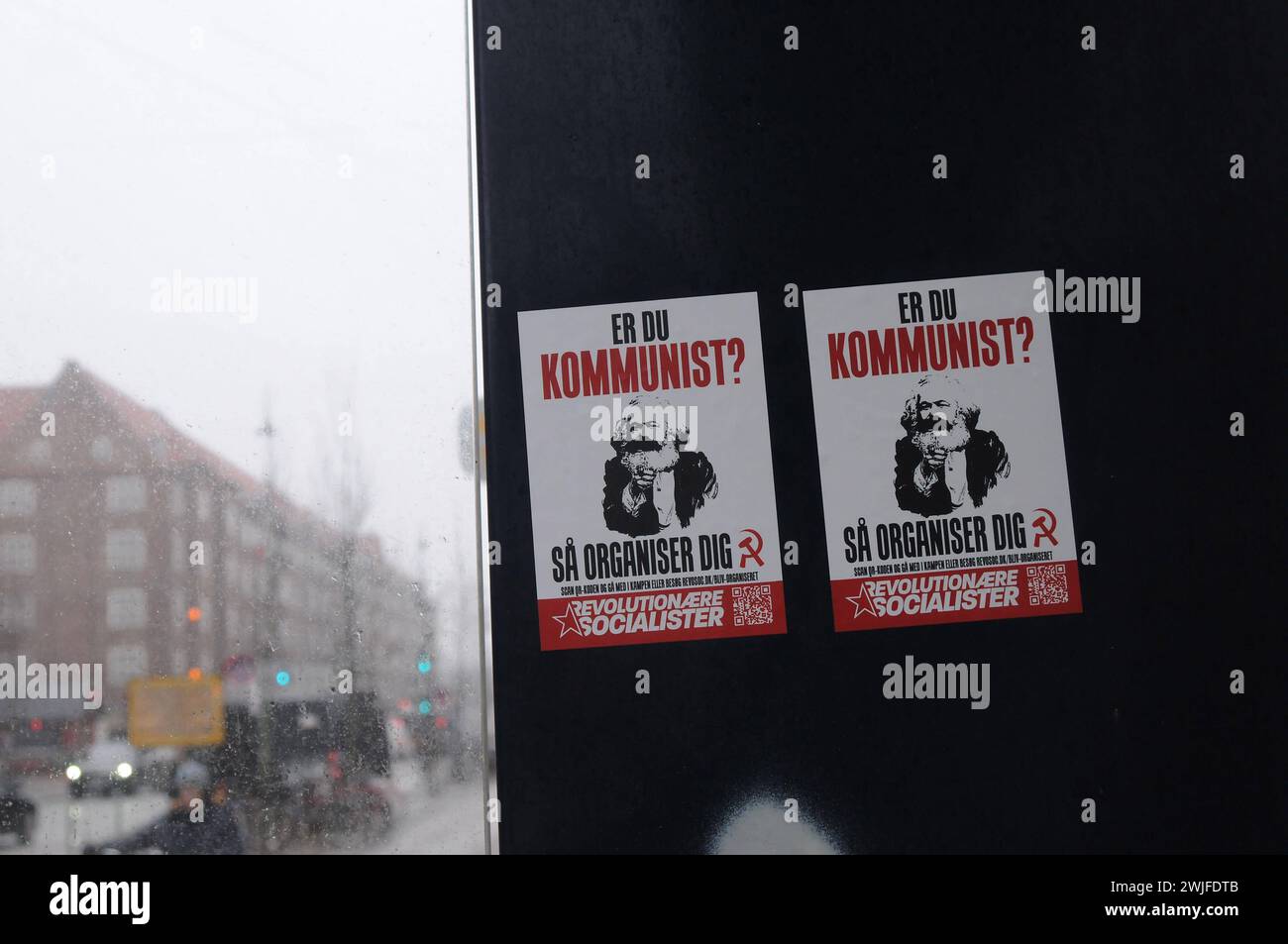 Copenhagen, Denmark /15 February 2024/.Two smll billboard read if you communist to join revolation socialists billboar on bus stop styand in Copenhagen. Photo.Francis Joseph Dean/Dean Pictures Stock Photo