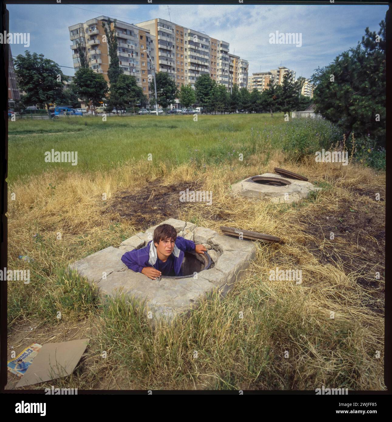 Romania, Bucarest. Homeless youth find shelter in a sewer. Stock Photo