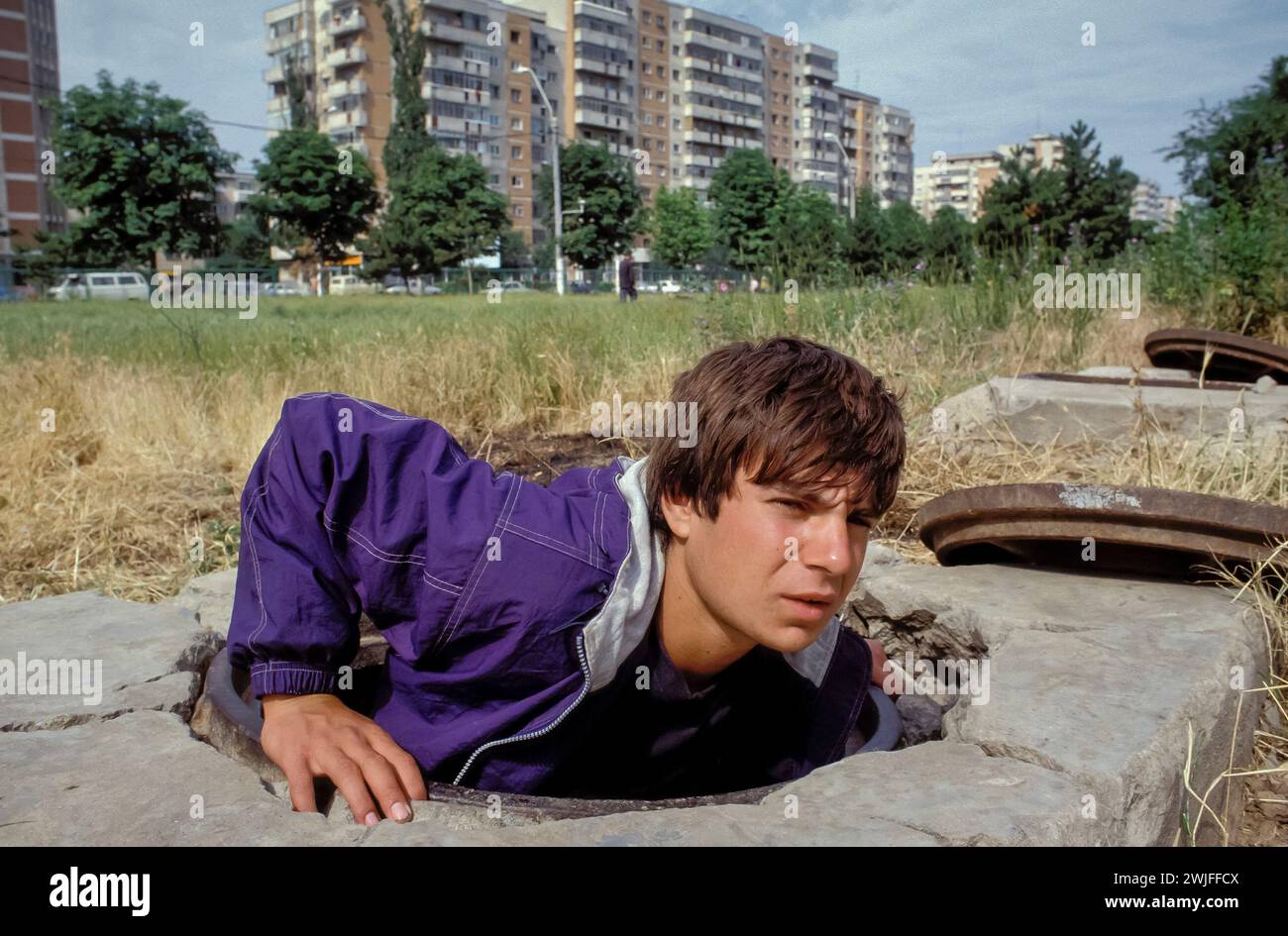 Romania, Bucarest. Homeless youth find shelter in a sewer. Stock Photo