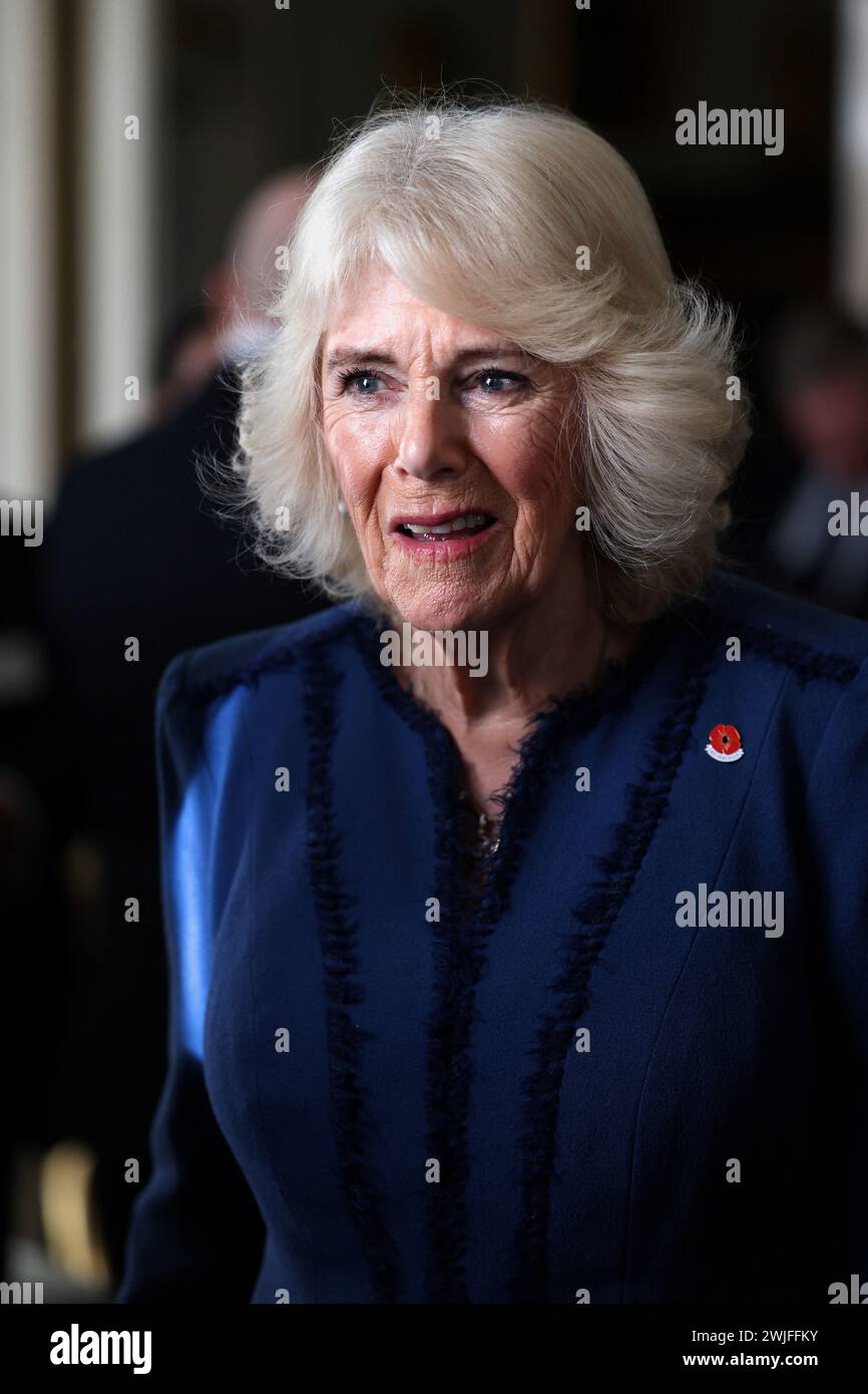 Queen Camilla during a celebration at Clarence House, central London, marking the centenary of The Poppy Factory, which was founded in the aftermath of the First World War. The reception also marks 100 years since the charity began the move to its historic home in Richmond upon Thames, south west London. Picture date: Thursday February 15, 2024. Stock Photo