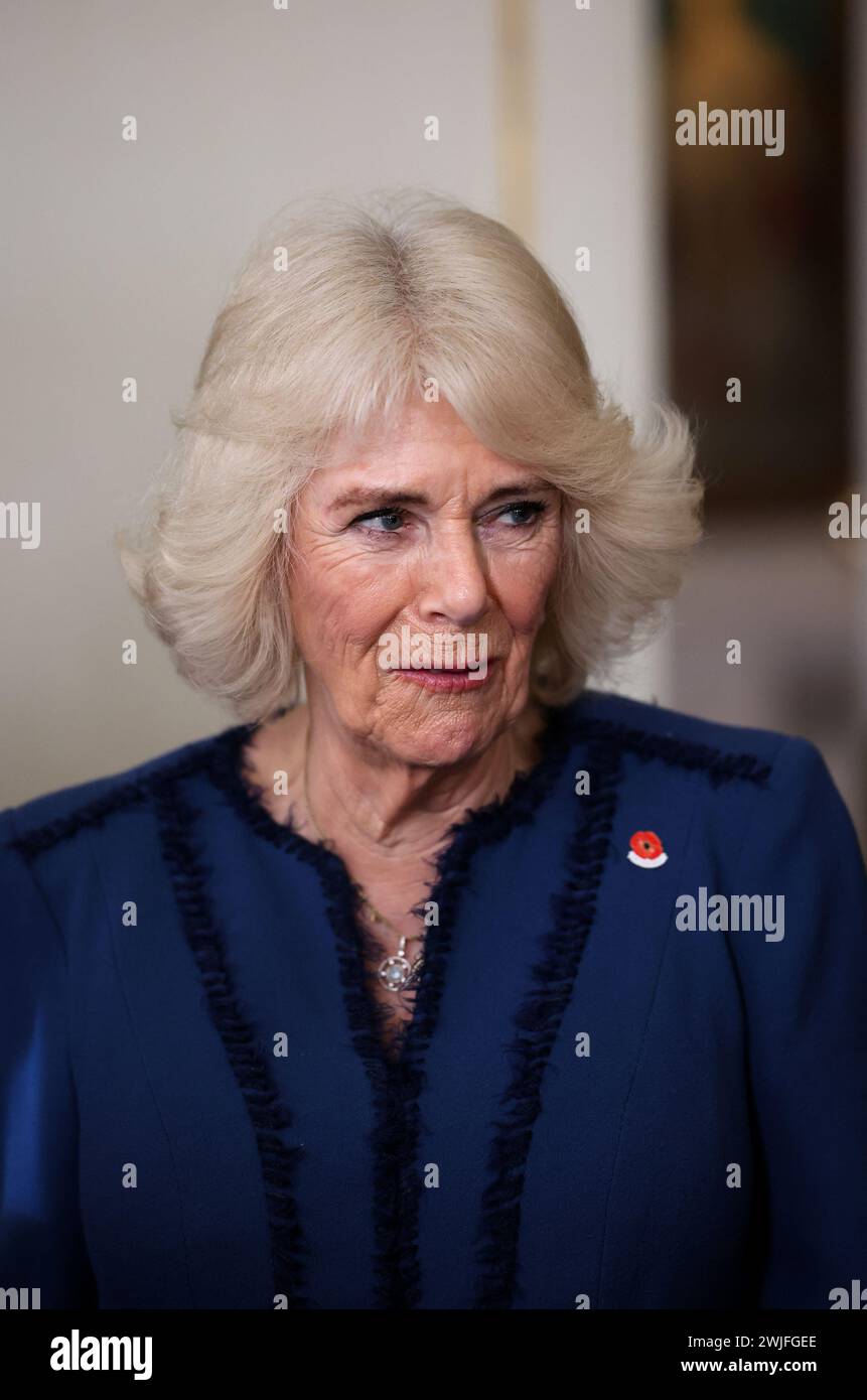 Queen Camilla during a celebration at Clarence House, central London, marking the centenary of The Poppy Factory, which was founded in the aftermath of the First World War. The reception also marks 100 years since the charity began the move to its historic home in Richmond upon Thames, south west London. Picture date: Thursday February 15, 2024. Stock Photo