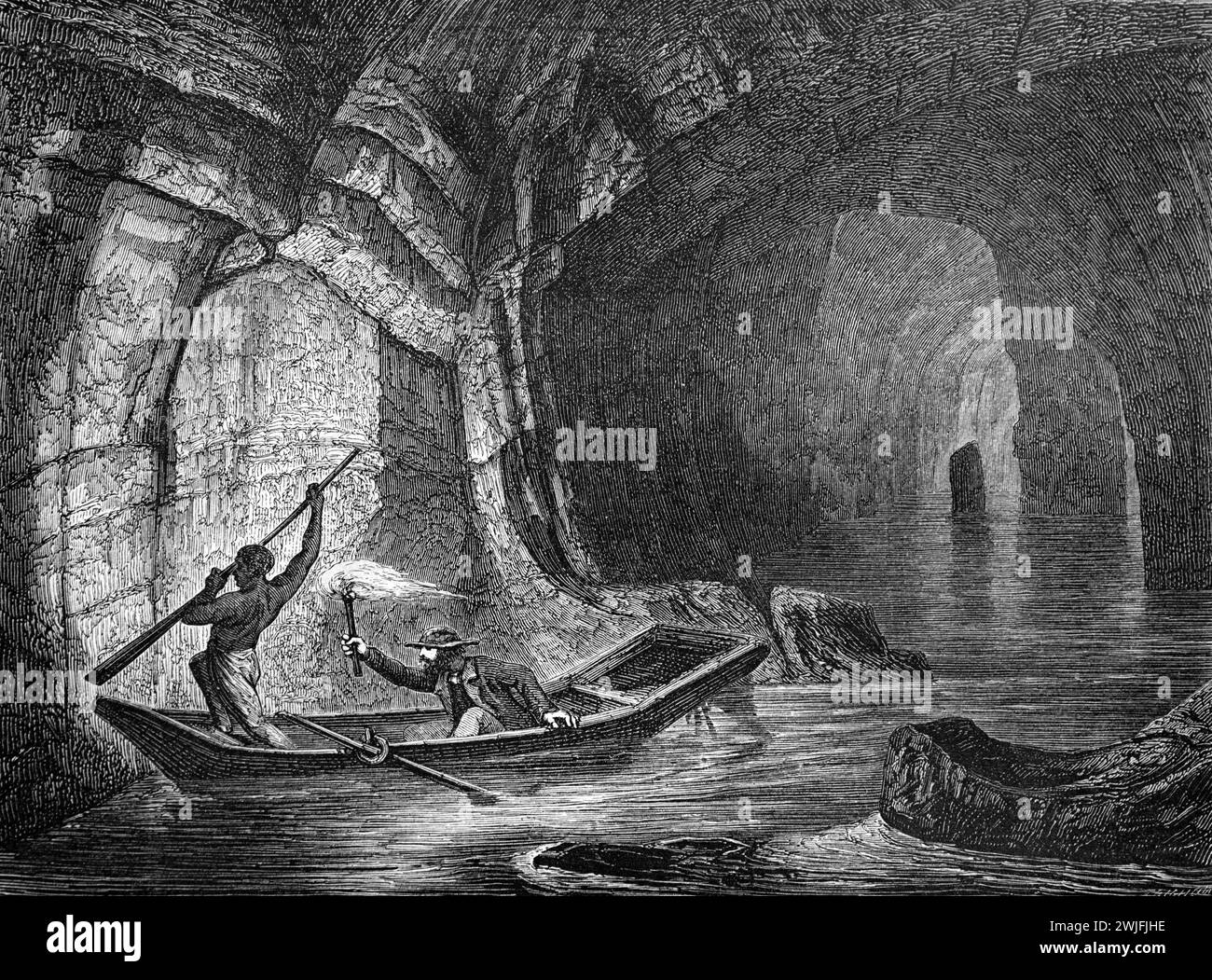 Visitors Explore the Mammoth Cave in the Mammoth Cave National Park, by Rowing Boat or Row Boat along the Subterranean Green River, Kentucky, US, USA Or United States of America. Vintage or Historic Engraving or Illustration 1863 Stock Photo