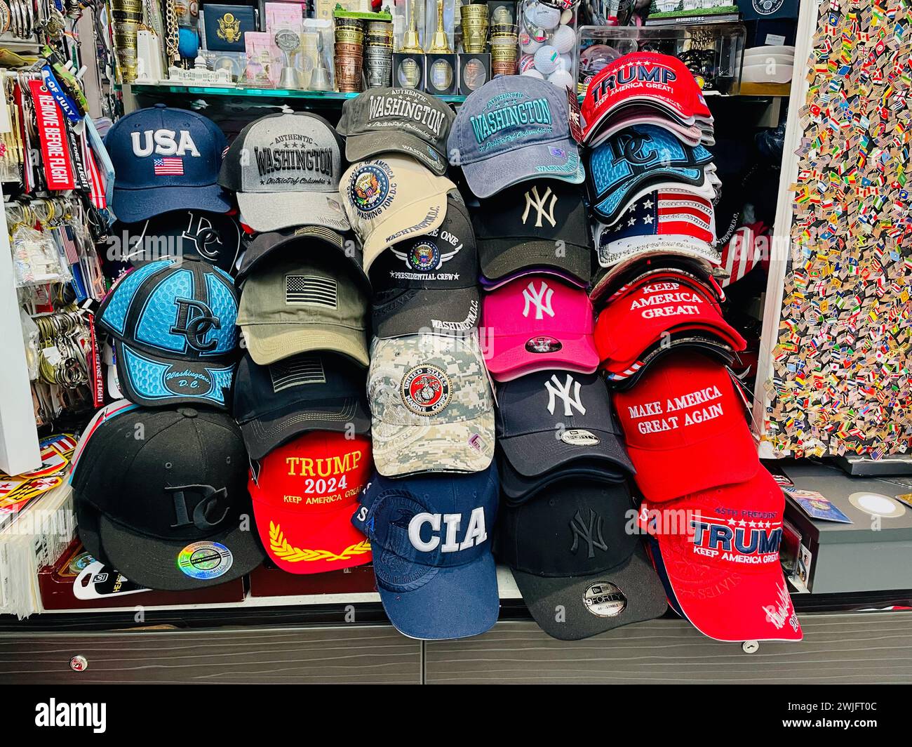 Sterling, Virginia, USA - February 5, 2024: A variety of souvenir hats and trinkets for sale at a Dulles International Airport kiosk. Stock Photo