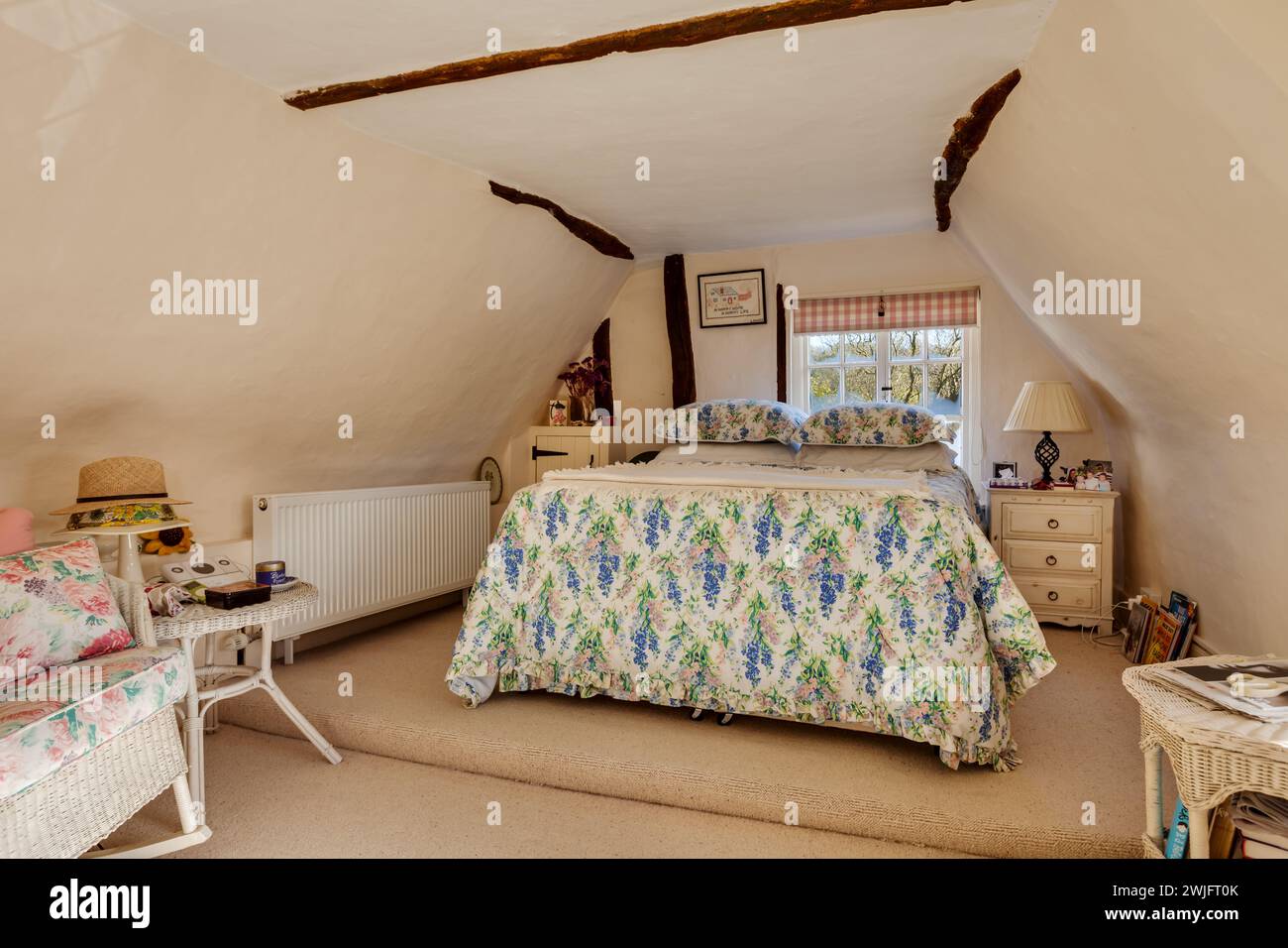 Dalham, Suffolk, England - Feb 19 2016: 16th Century english attic style cottage bedroom Stock Photo