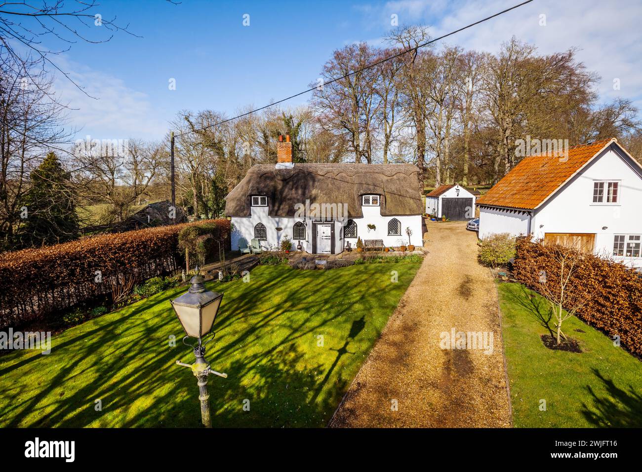 Dalham, Suffolk, England - Feb 19 2016: 16th Century thatched grade II listed cottage in countryside Stock Photo