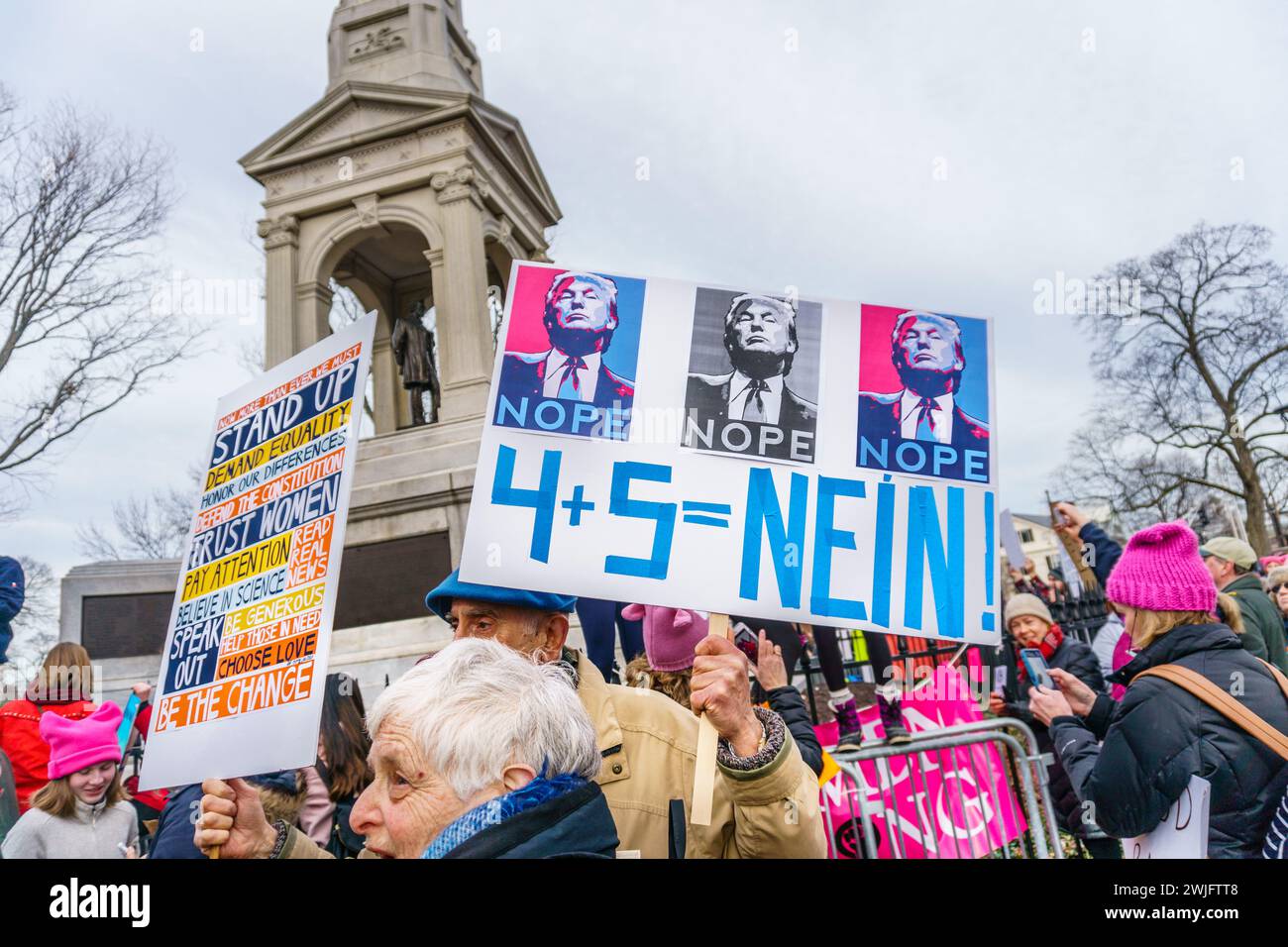 Cambridge, MA, USA–January 20, 2018. Rally on the 1st anniversary of the Women's March. Many displayed anti-Trump signs . Stock Photo