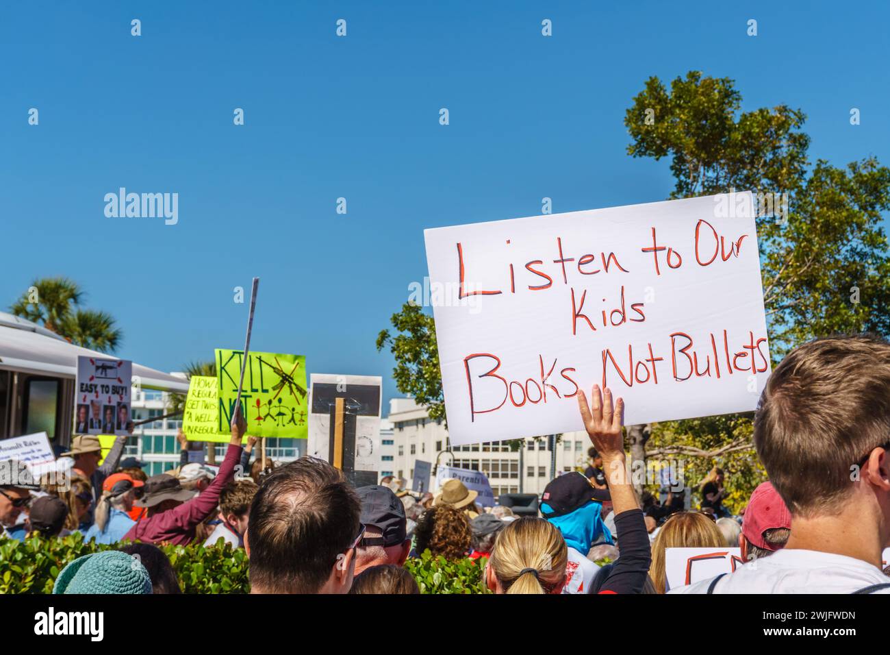 Sarasota, FL, US -March 24, 2018 - Protesters gather  holding sign reading 'Listen to our Kids Books not Bullets' Stock Photo