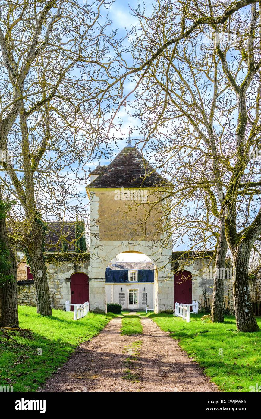Entrance gateway, tower and arch to the Notz l'Abbé religious priory, Indre (36), France. Stock Photo