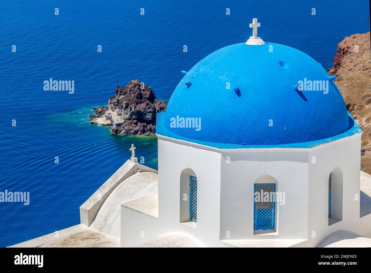 Typical white and blue architecture with domes and churches of Oia village on Santorini island, Greece. Stock Photo