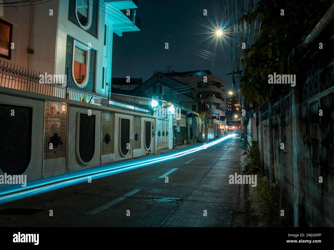 fast and blurry car movement on the roadway at night on the street Stock Photo