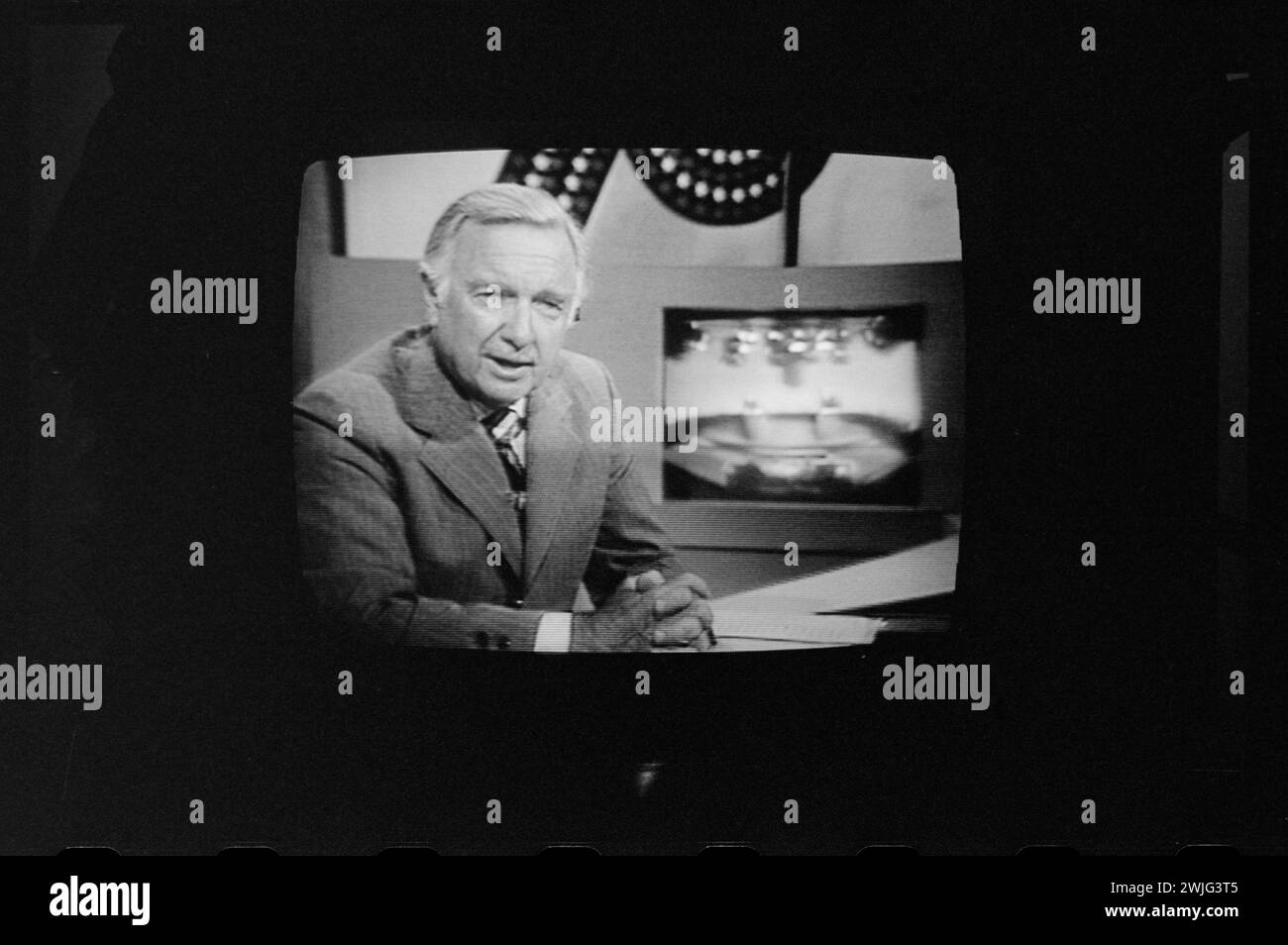 Walter Cronkite on television during the first presidential debate between Ford and Carter, Philadelphia, Pennsylvania, 9/23/1976. (Photo by Thomas O'Halloran/US News and World Report Magazine Collection) Stock Photo