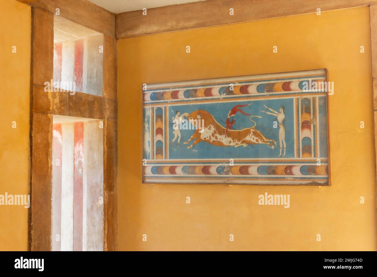 Palace of Minos, Knossos, Crete, Greece.  Bull-leaping fresco now in the Heraklion Archaeological Museum. Stock Photo