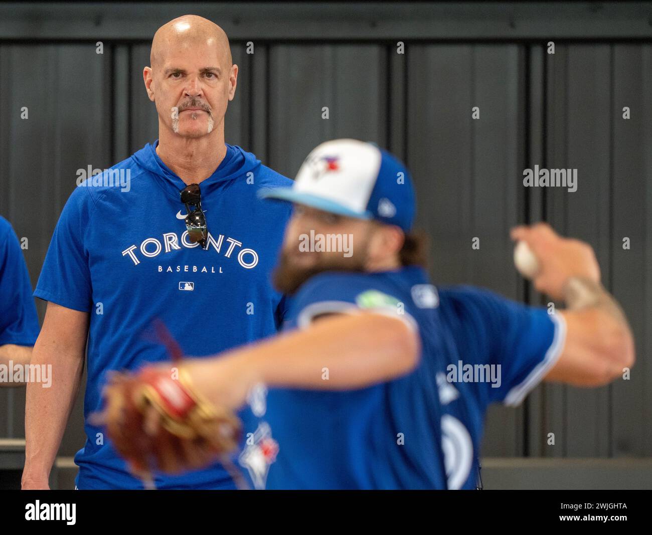 Dunedin, USA. 15th Feb, 2024. Toronto Blue Jays pitching coach Pete Walker watches pitcher Alek