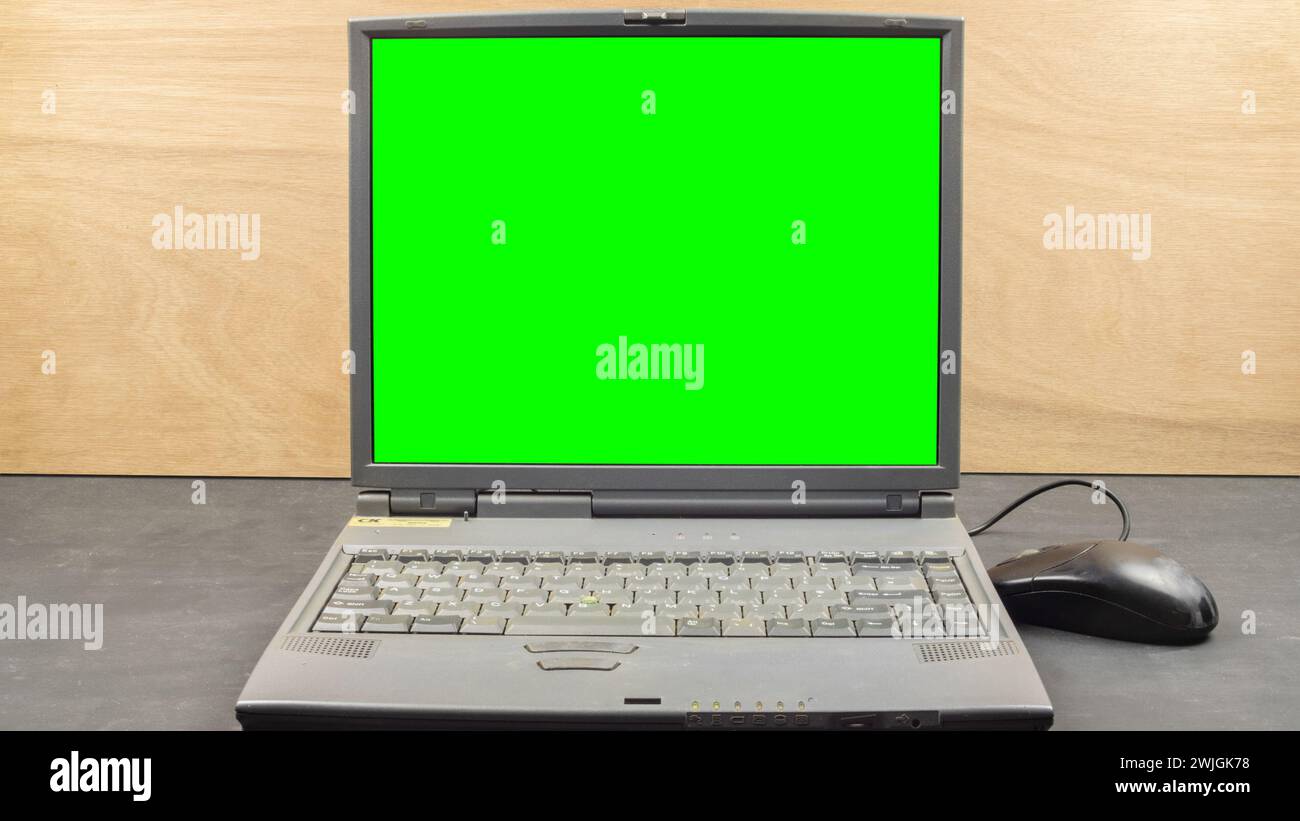 Laptop computer green screen ready for keying. IT old technology. Stock Photo