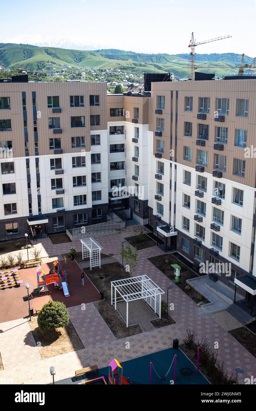 View of Top view modern apartment buildings with a courtyard playground ...