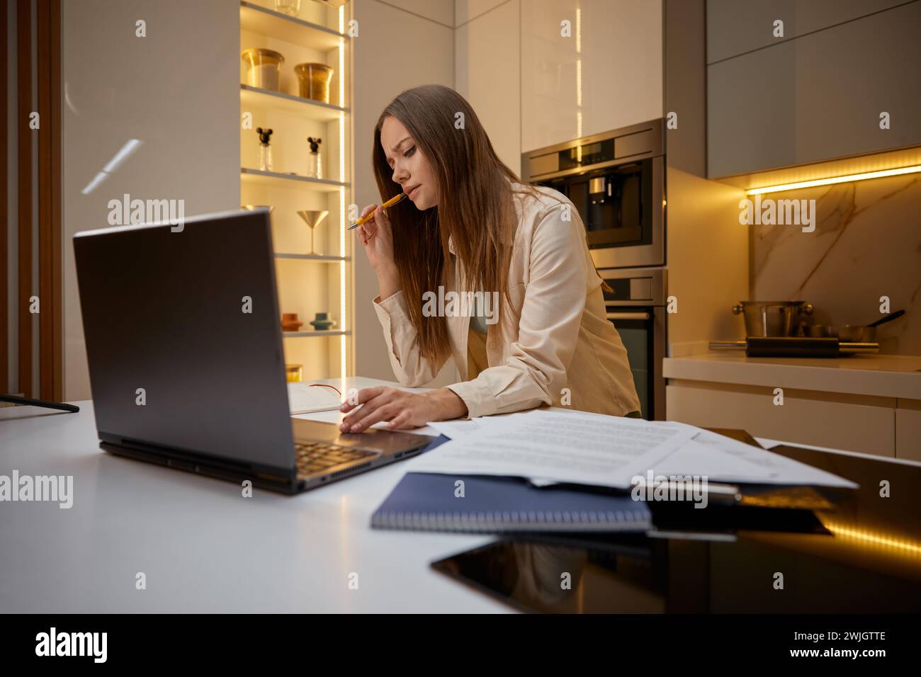 Woman using laptop working or studying from home Stock Photo
