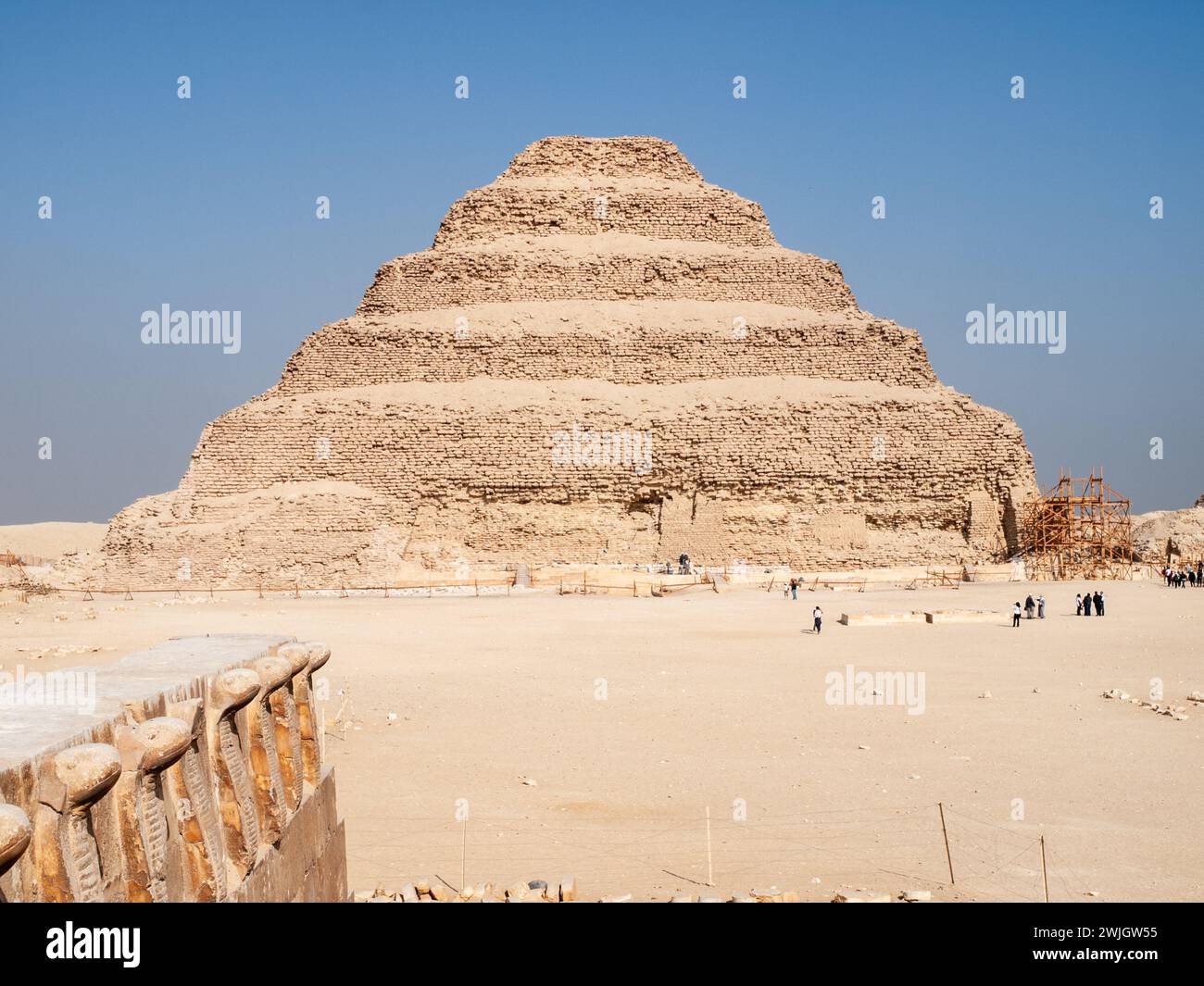 The step pyramid of Zoser on a sunny day with blue sky, Saqqara necropolis, Guiza, Egypt. Stock Photo